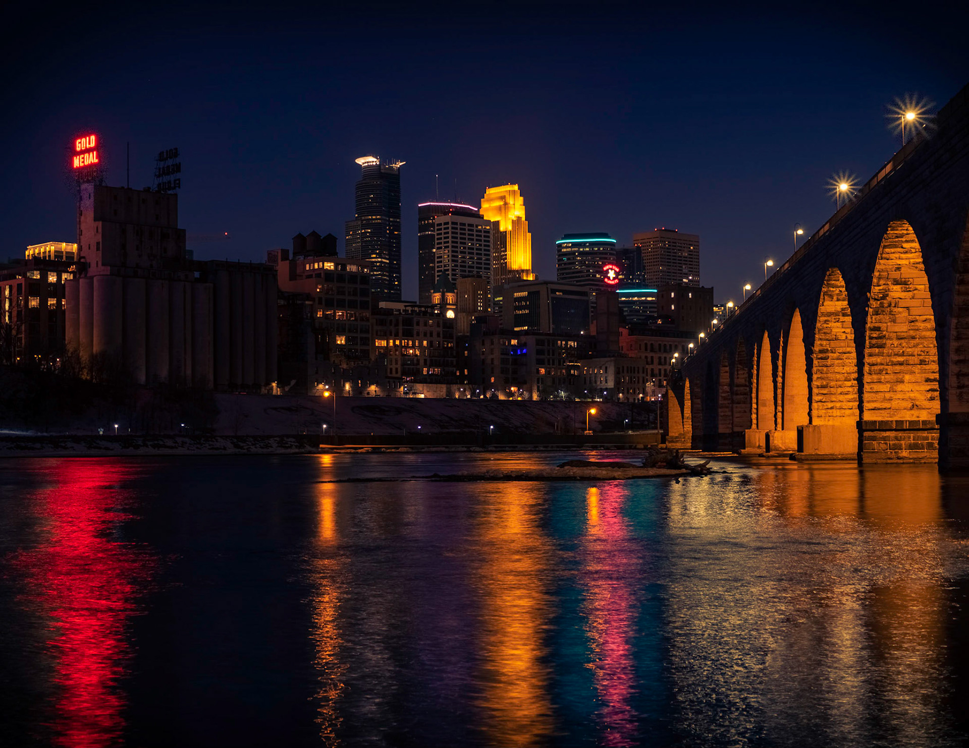 Colorful Reflections - A nice warm winters night, spilling the colors of the city in the waters reflection.