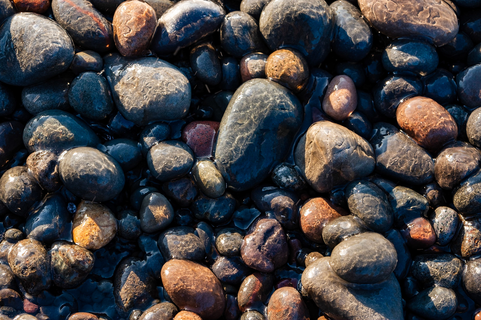 A thin cover of ice gives these rocks a marbled effect.