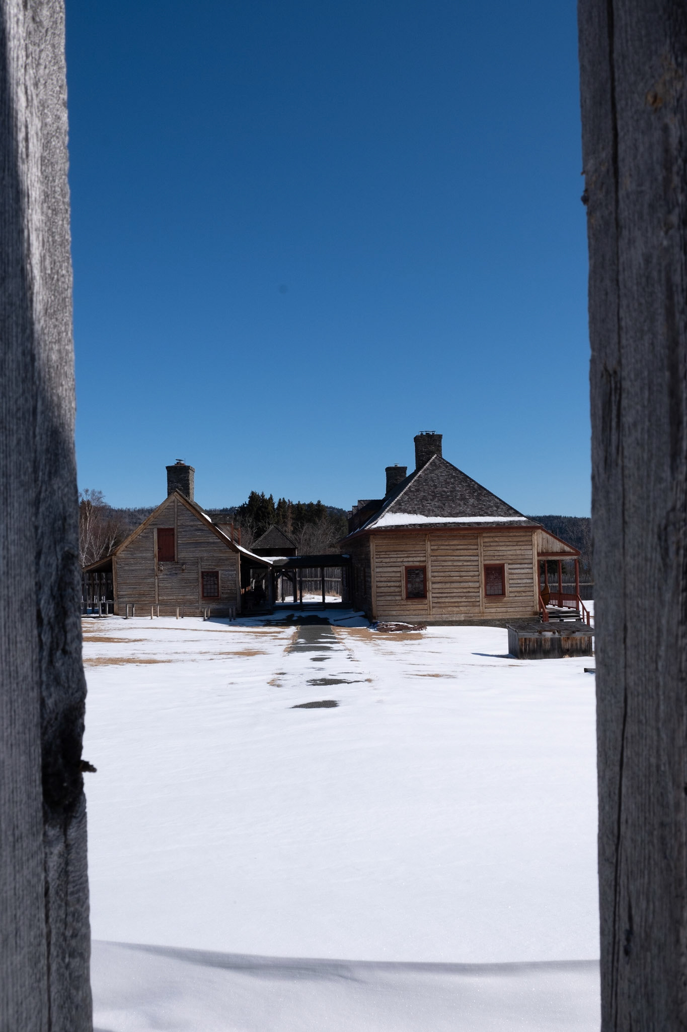 Through the front gates of the Fur Trade Depot looking at the great hall.