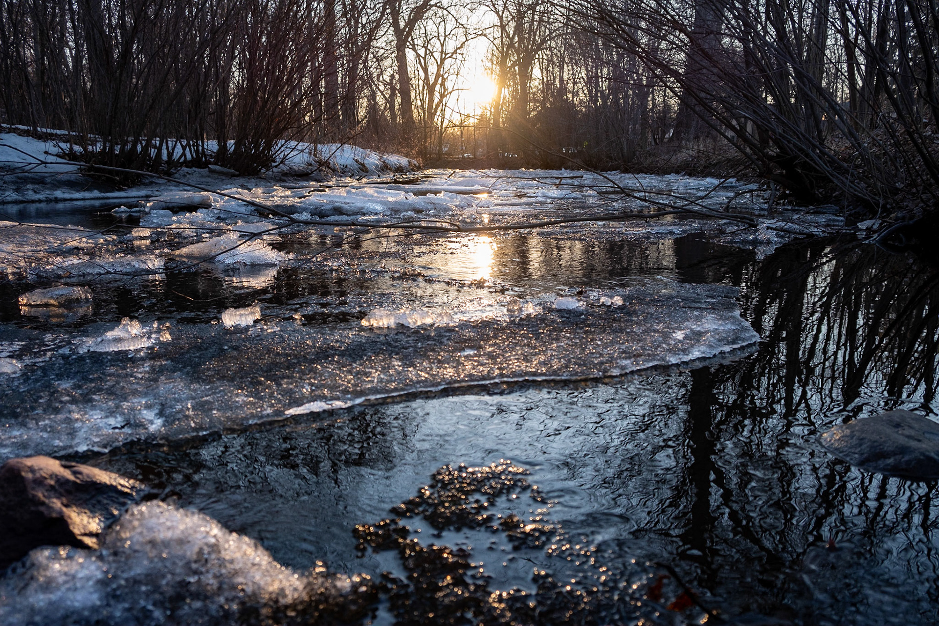 The warmth of the sun pushing the ice away -
