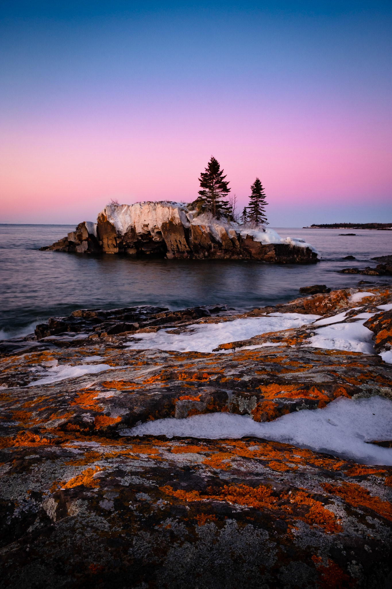 The lichen covered rocks are what caught my eye to take this picture. The sun was being less dramatic now that it was a whole 30 mins old in the sky. But these colors still gave some interest to this perspective.