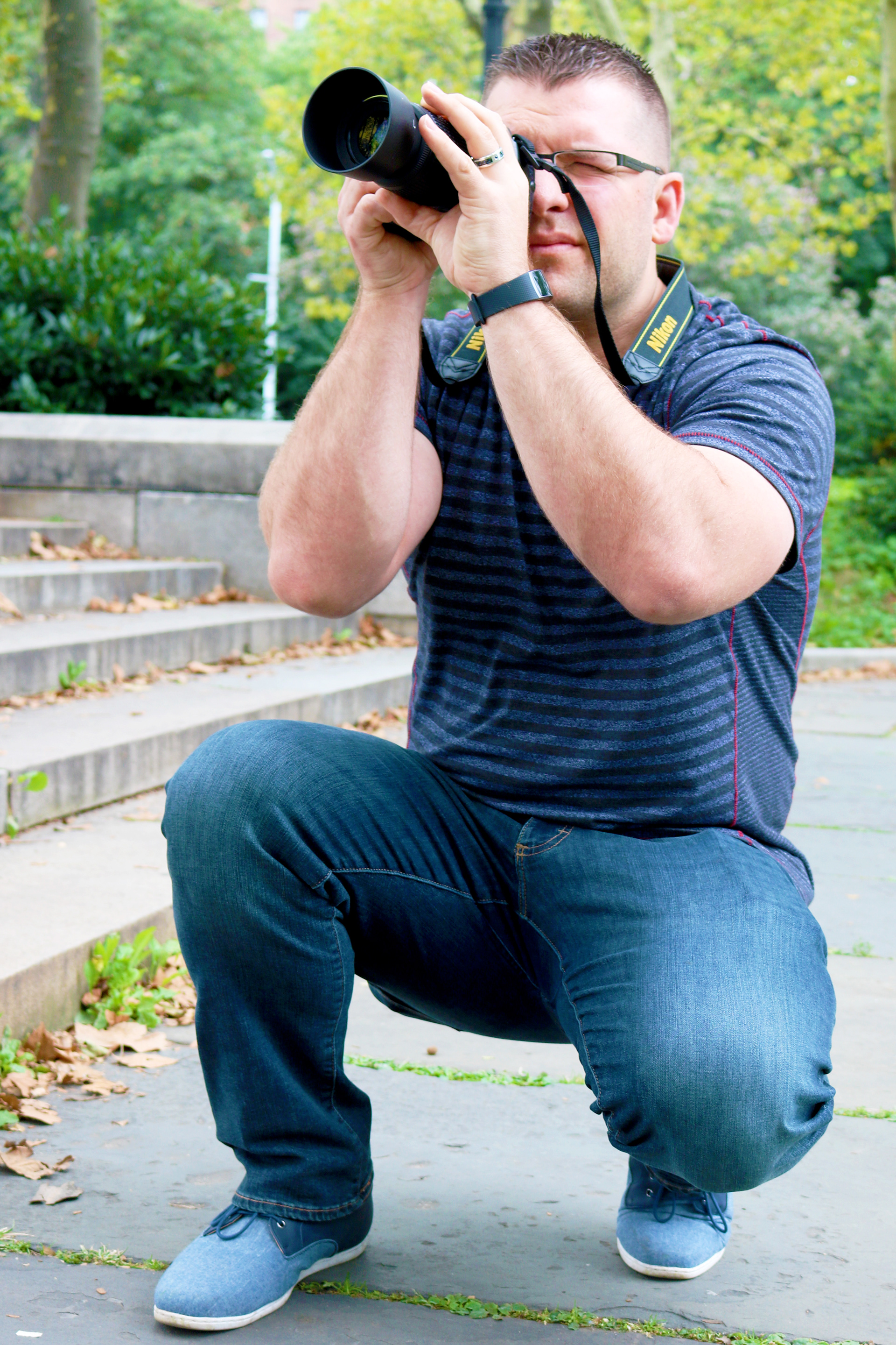 Man holding a camera taking a photo