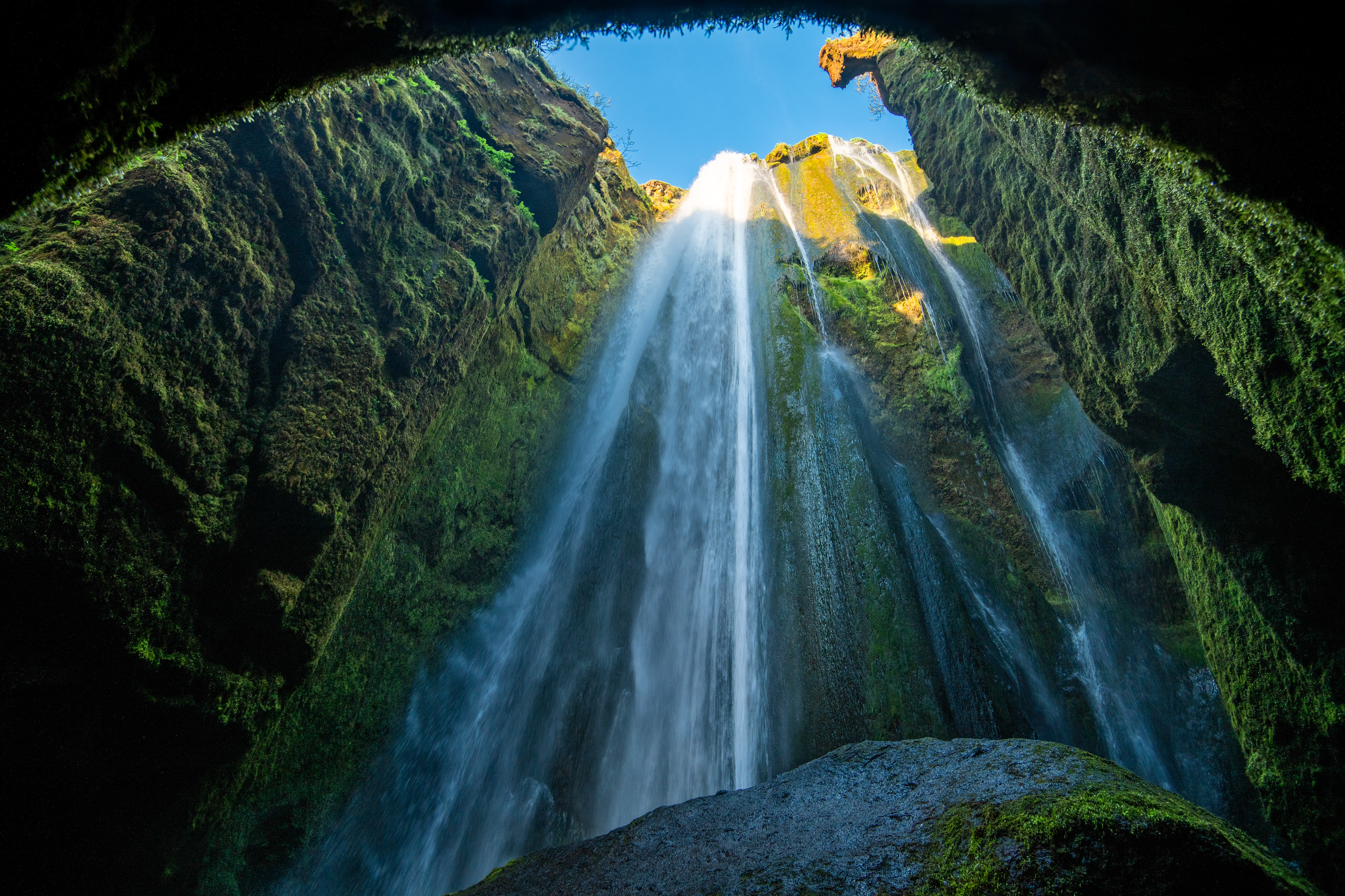 Inside the ravine where the stream falls down in a beautiful waterfall