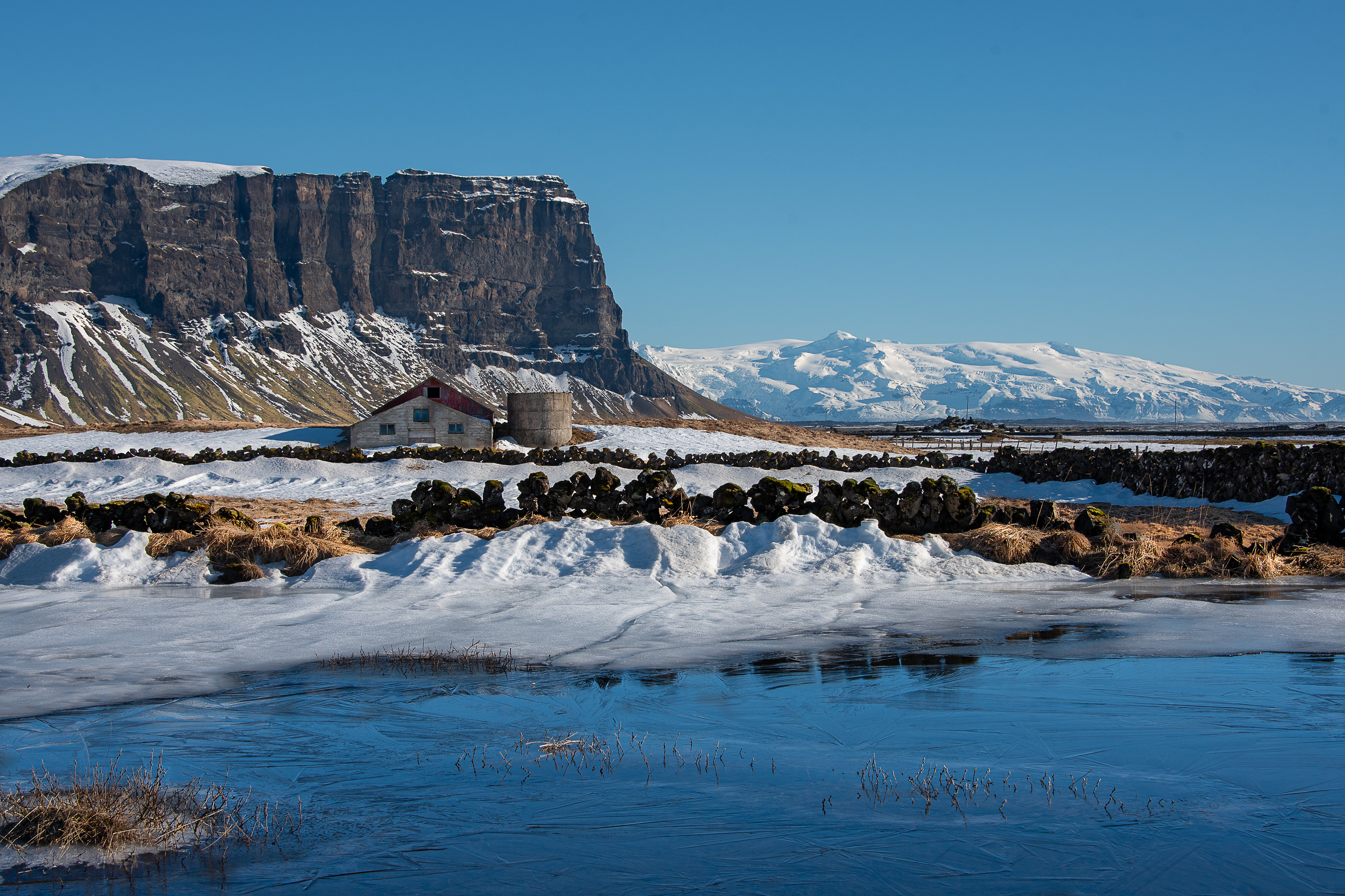 Lomagnúpur is a spectacular sight in winter with Öræfajökull glacier in the background