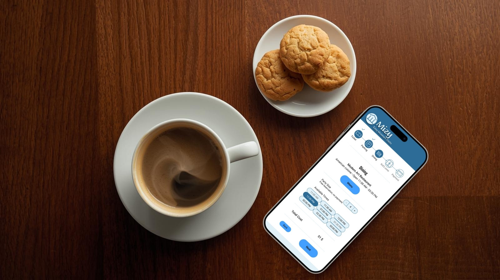 cup of coffee and biscuits and Mizy app showing on an iPhone screen