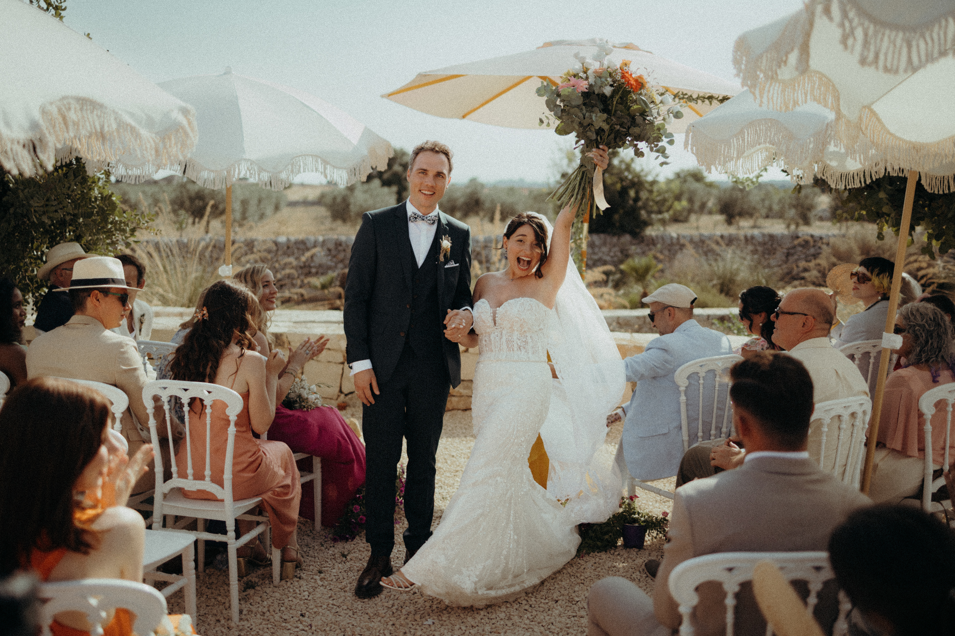 Luxury villa wedding in Sicily with Mediterranean coastal scenery.