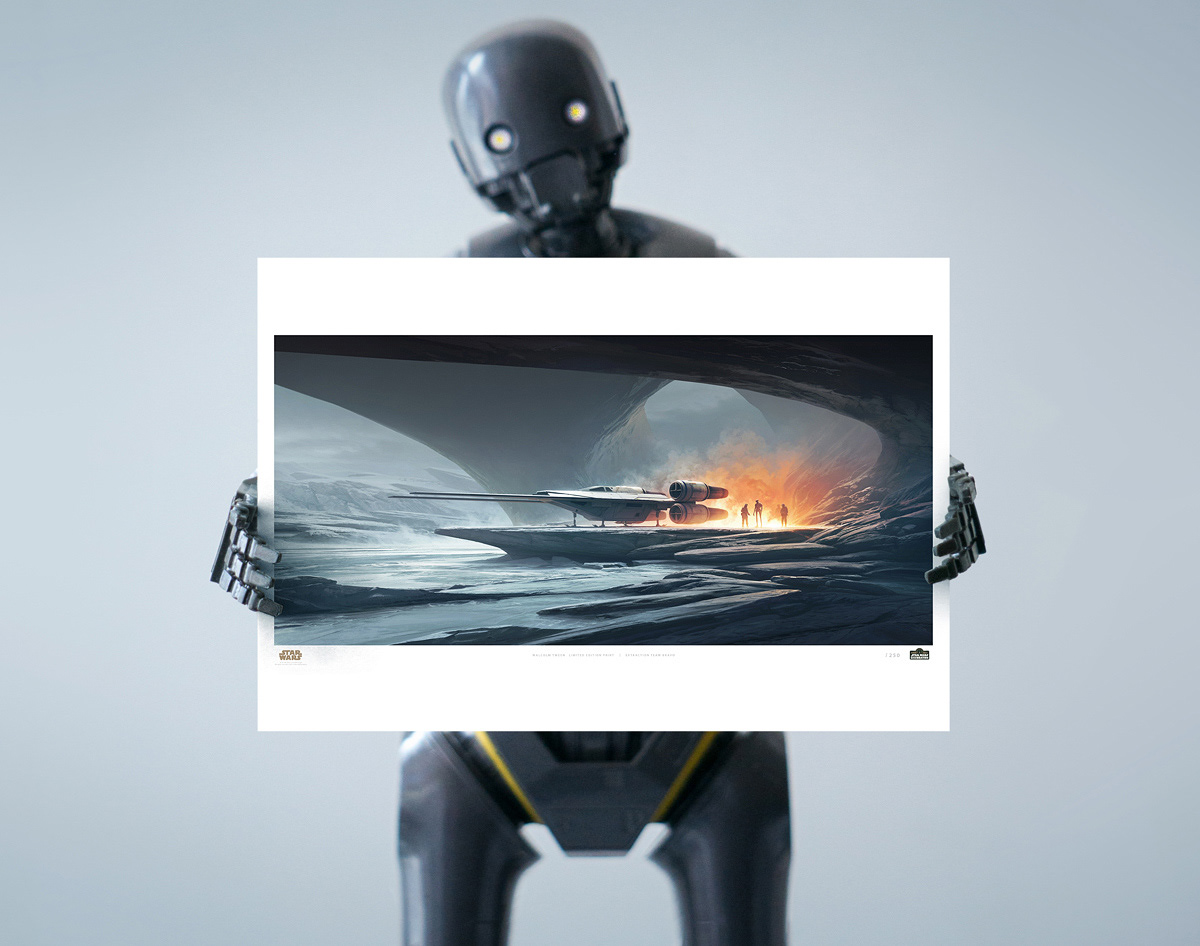 K-2SO robot holding a copy of the 2023 Limited edition Star Wars Art Print by Malcolm Tween Extraction-Team-Bravo