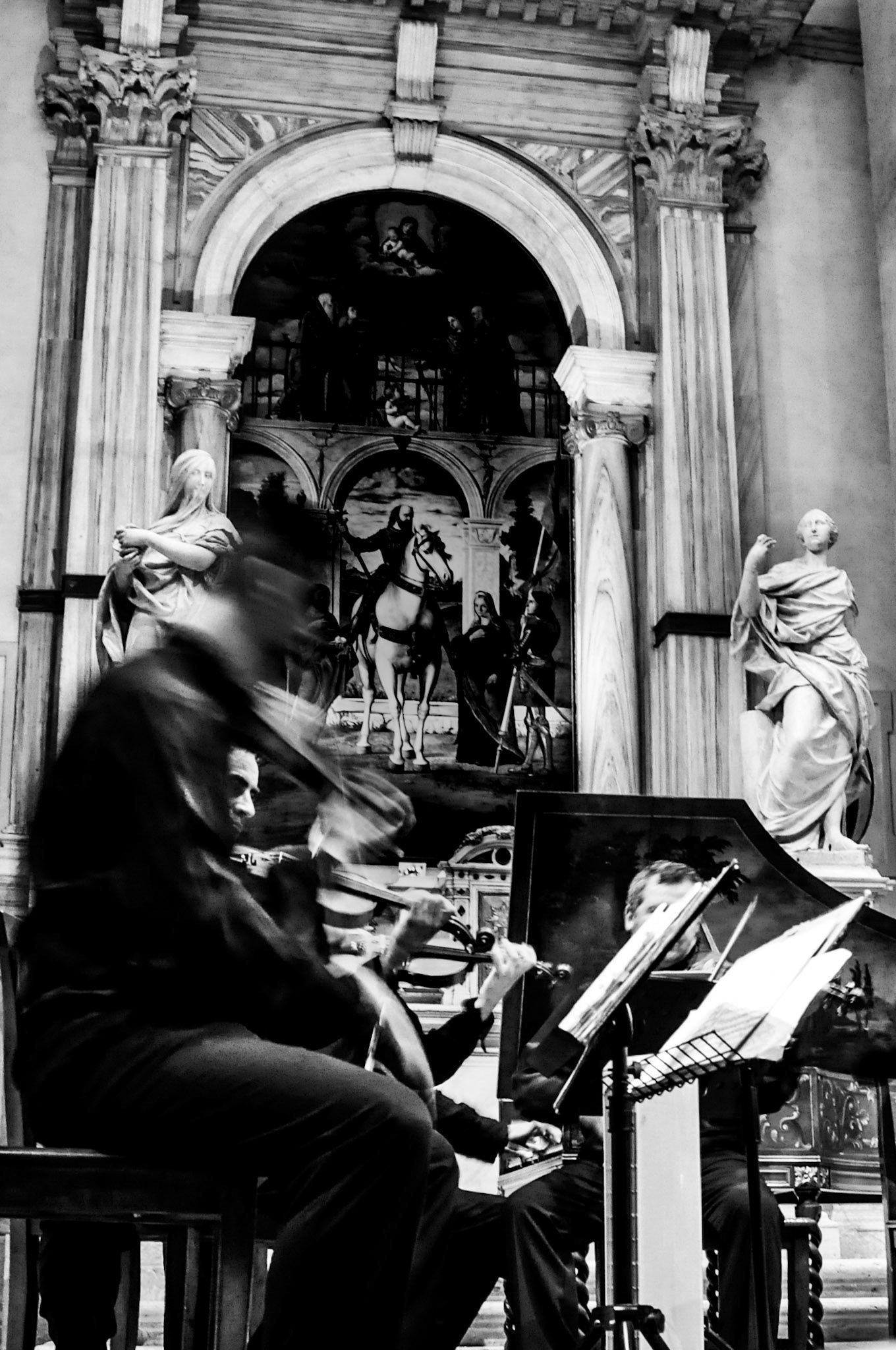 A single frame from an evening concert. The musicians are blurred by movement, while the church remains still. The photograph is less about who performed than about the feeling of live music echoing through an old building.