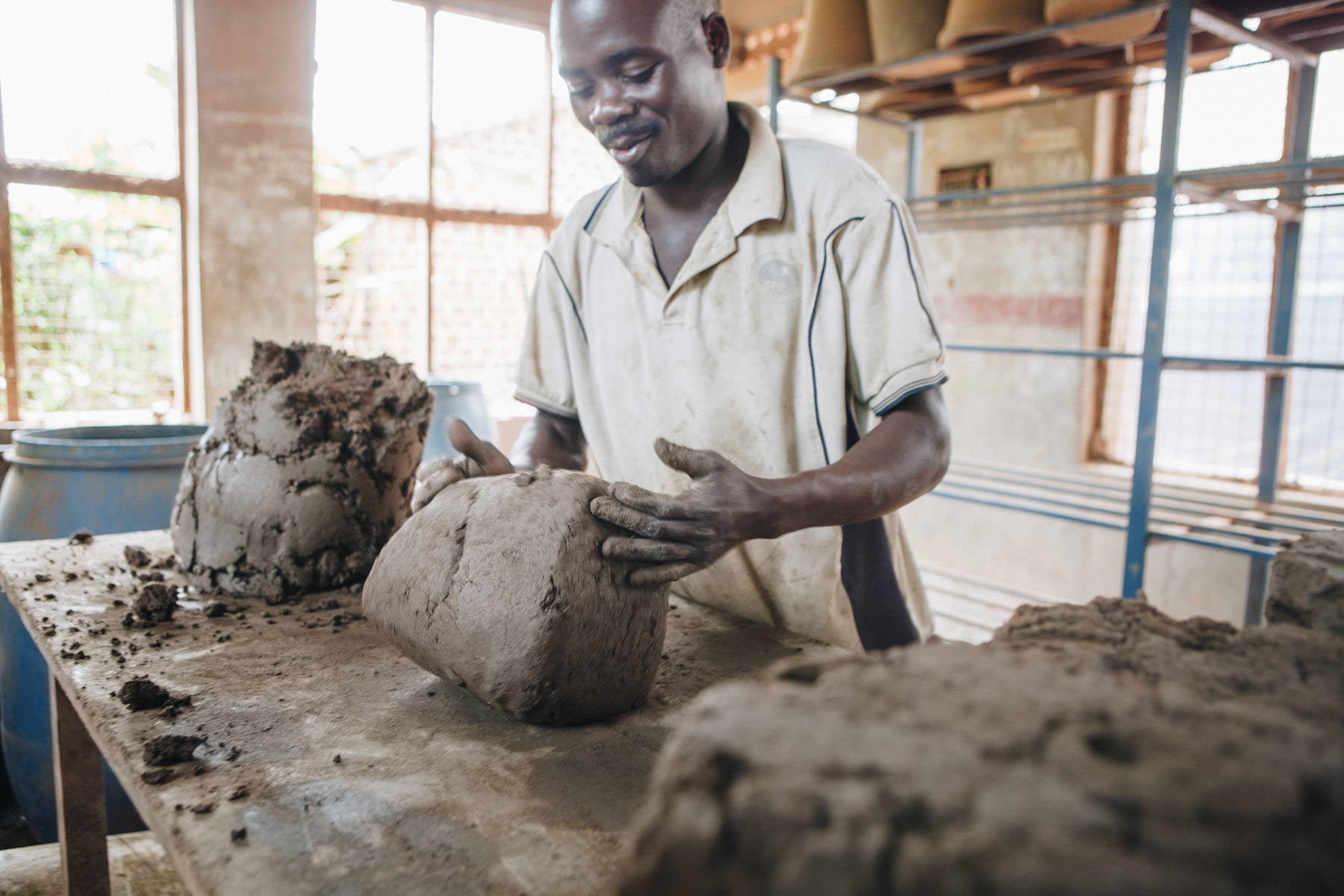 Water filter pot production, Uganda - editorial for non-profit Yunus Social Business (YSB)