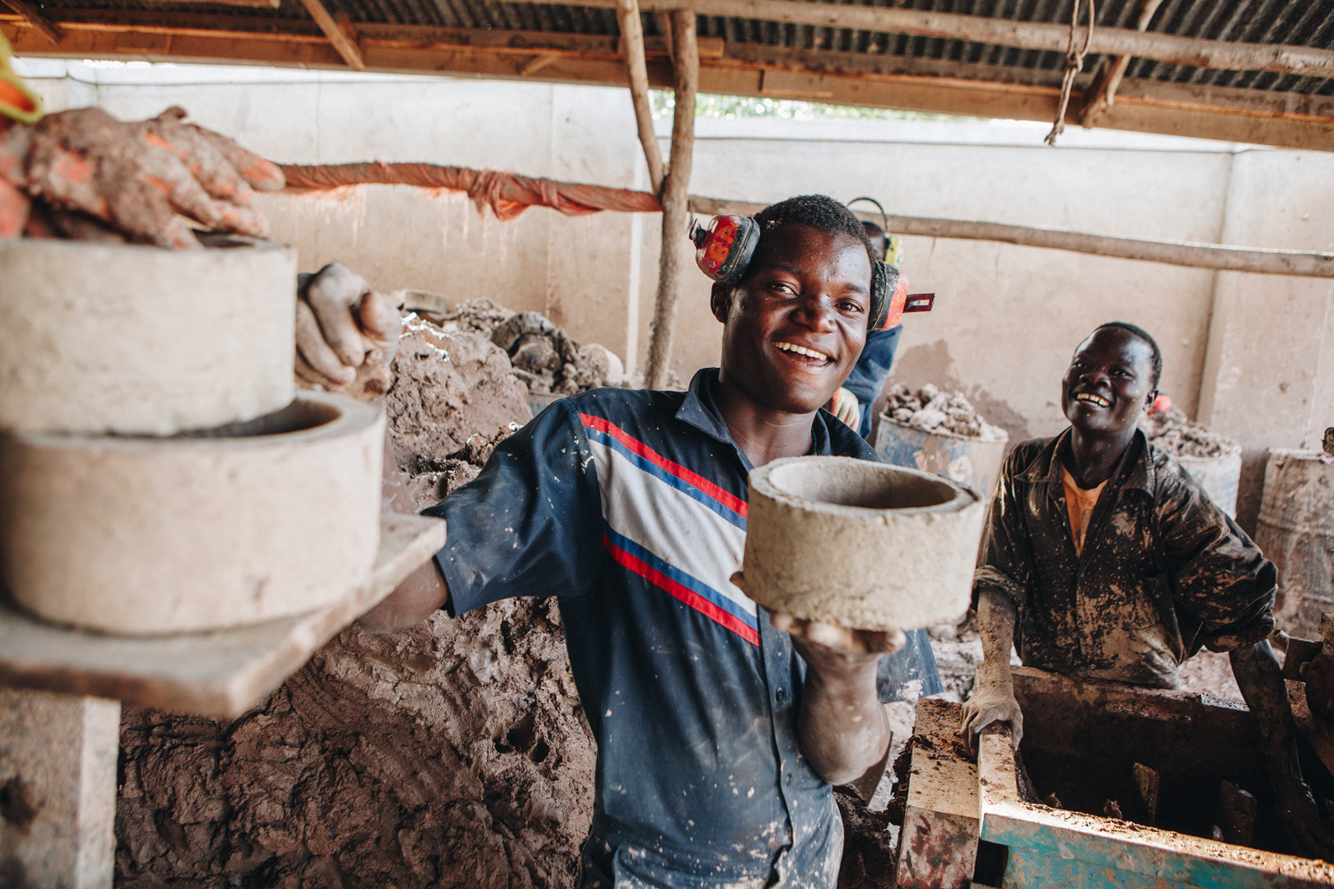 Workers at Bio-fuel facility, Uganda - editorial for non-profit Yunus Social Business (YSB)