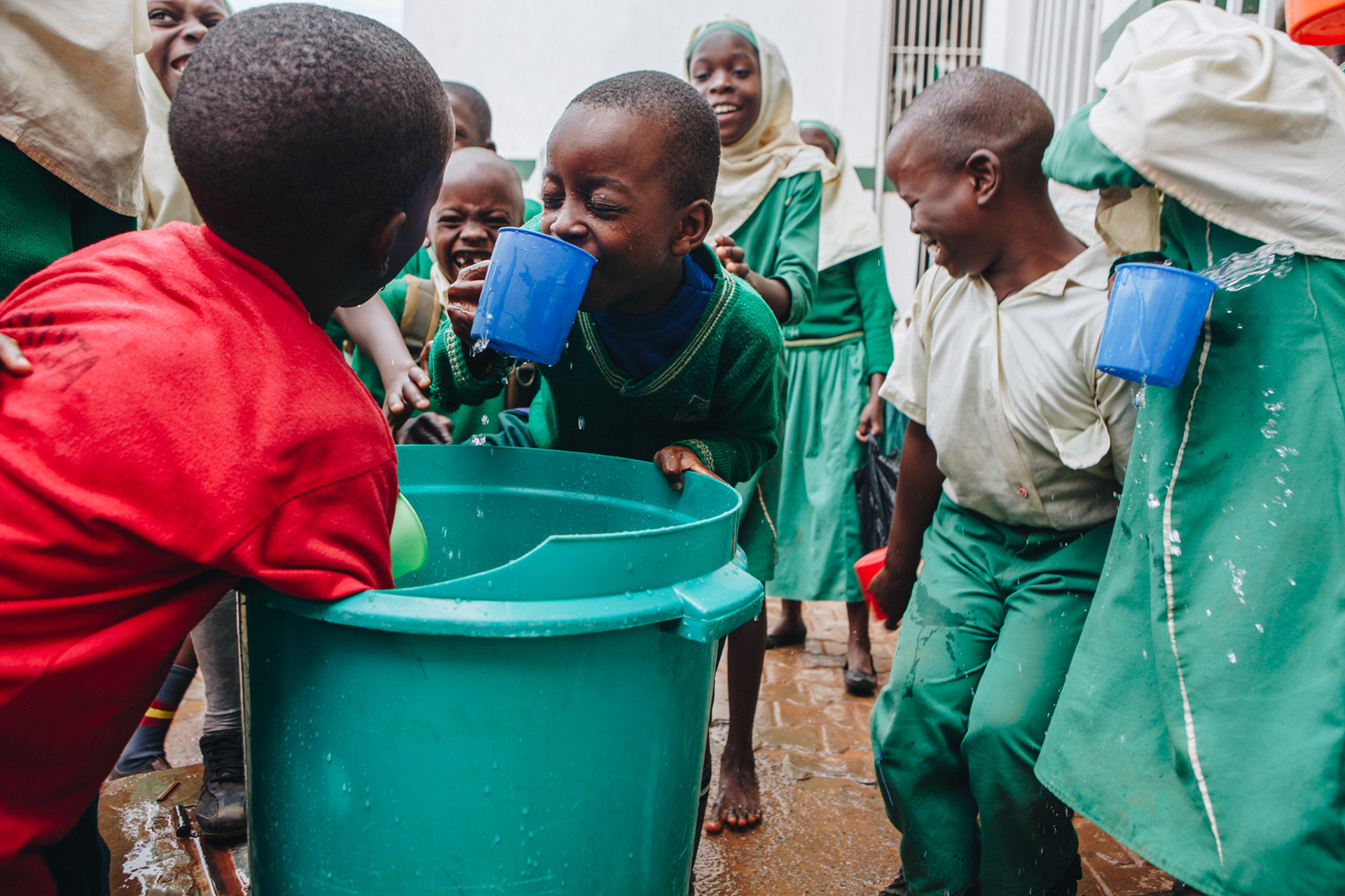 Clean drinking water at school in Uganda - editorial for non-profit Yunus Social Business (YSB)