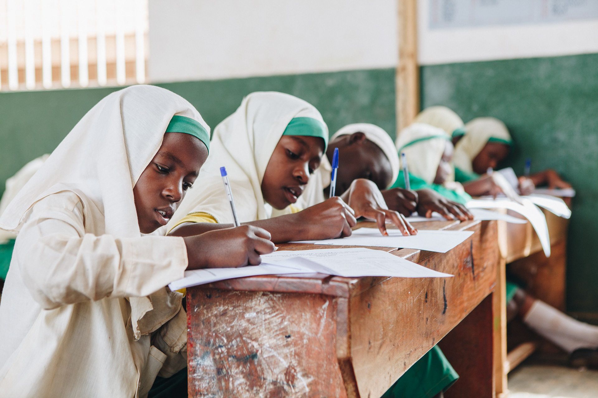 Students at school in Uganda - editorial for non-profit Yunus Social Business (YSB)