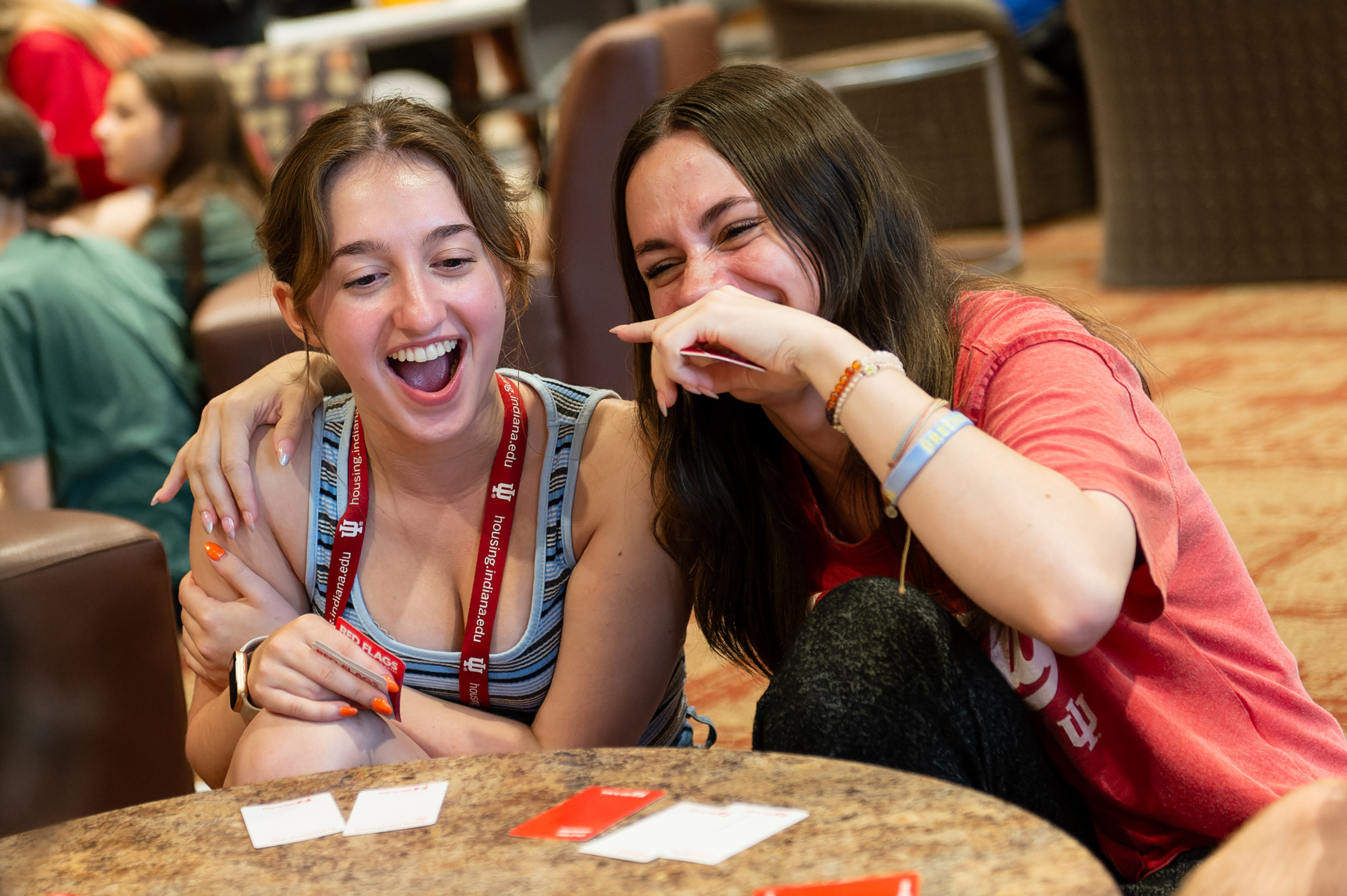 Indiana University High School Journalism Institute students Stefanie Noyer and Anda Paraschivu react while playing a card game with classmates, Wednesday, July 10, 2024, at Spruce Hall in Bloomington, Ind. Students at HSJI work on their journalism skills while enjoying university life, including leisure activities in the evening. (Vincent Hsiao/HSJI)