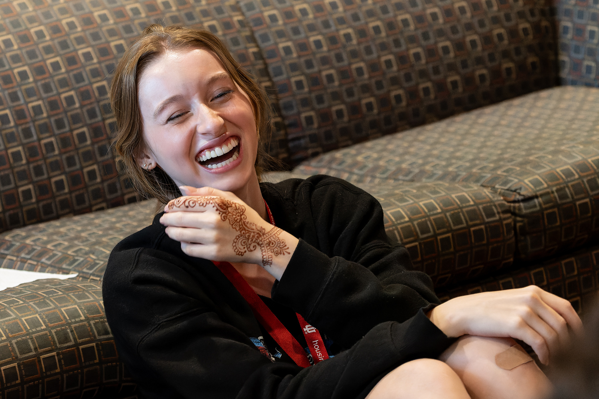 Indiana University High School Journalism Institute student Rihana van Houtte-Read reacts while playing a card game with classmates, Wednesday, July 10, 2024, at Spruce Hall in Bloomington, Ind. Students at HSJI work on their journalism skills while enjoying university life, including leisure activities in the evening. (Vincent Hsiao/HSJI)