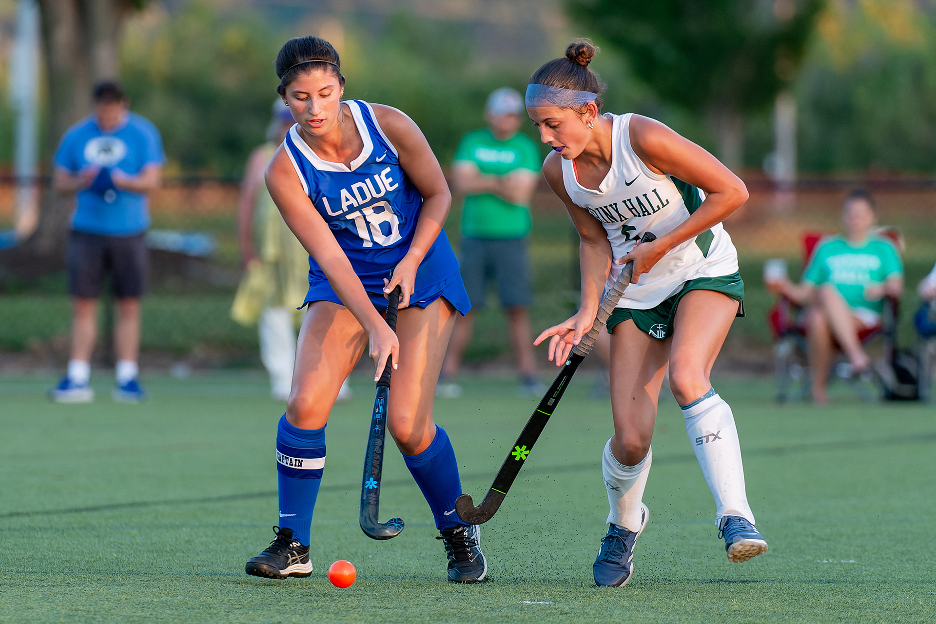 Ladue's Zoe Tenenbaum (12) navigates the ball past Nerinx Hall's Mary Kate Bryan during a field hockey match in the Gateway Tournament at Sportport Athletic Complex, Saturday, Aug. 31, 2024, in Maryland Heights, Mo. The Ladue Rams topped the Nerinx Hall Markers 6-2 and later won their tournament pool.