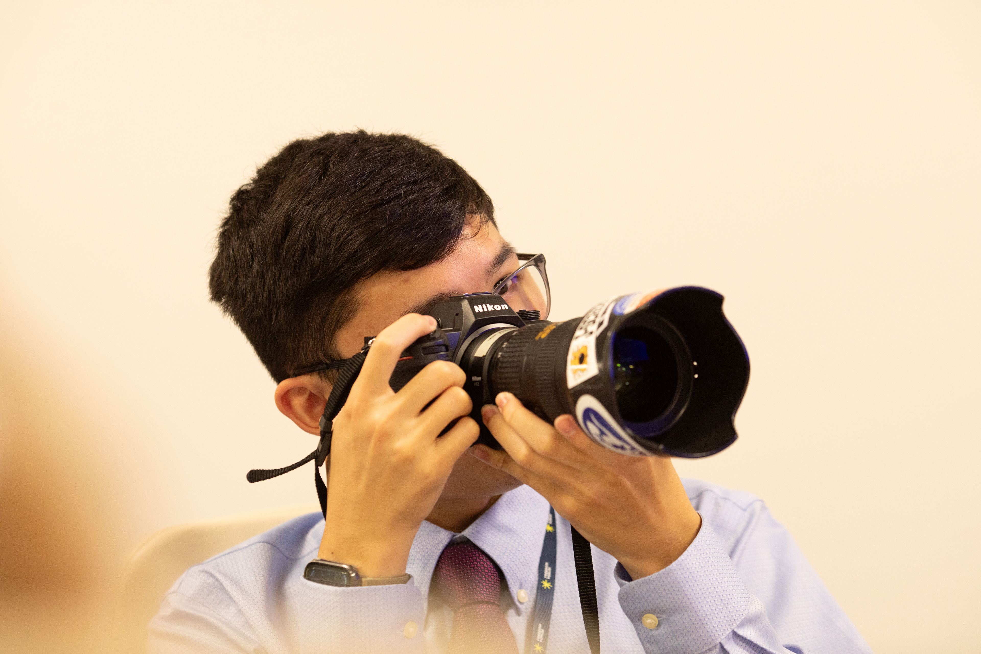 Taking photos of USA Today journalists at their Washington bureau during a tour as part of the Al Neuharth Free Spirit and Journalism Conference, June 2025. Photo courtesy of Freedom Forum