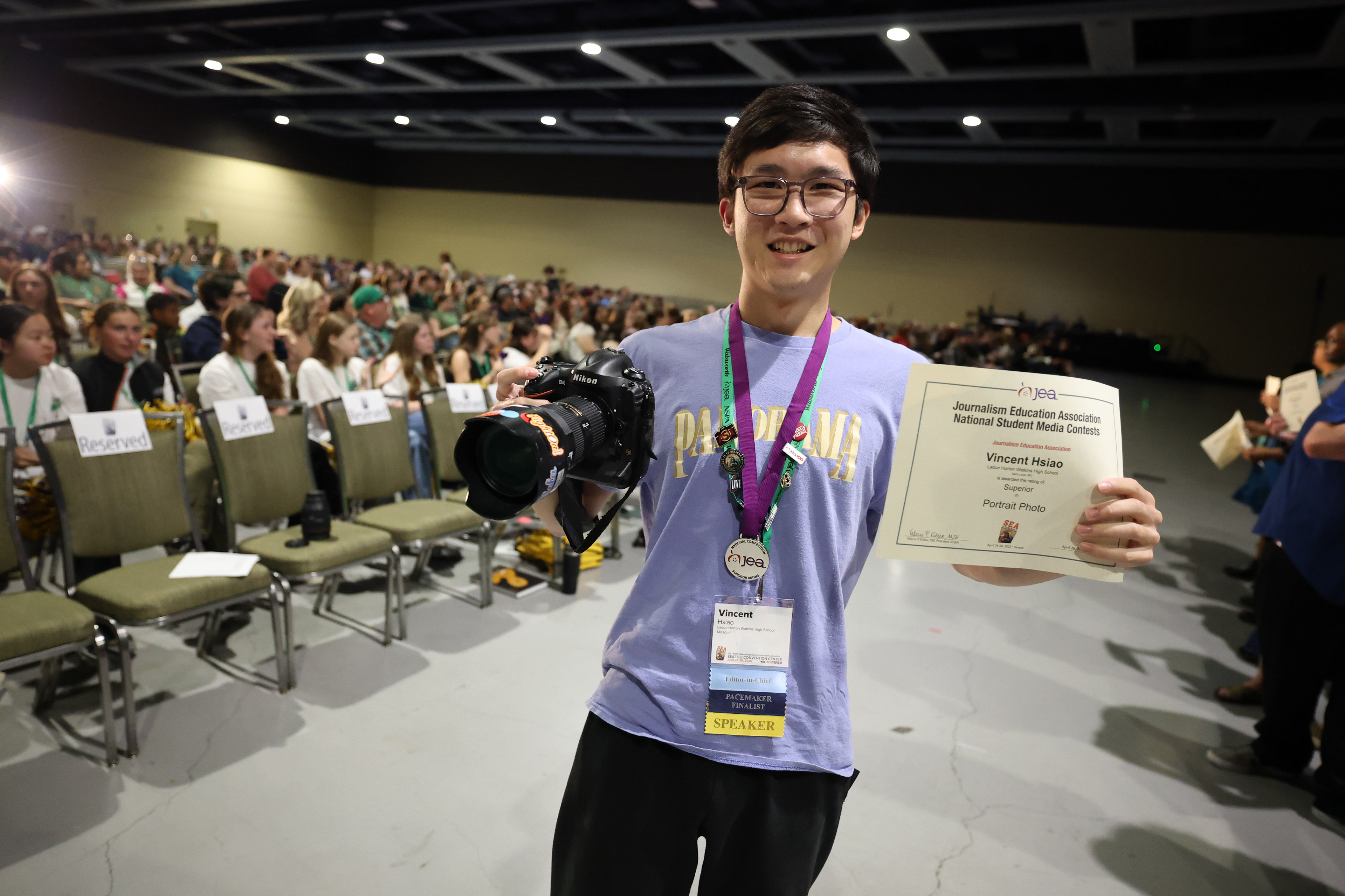 Posing for a photo at the closing awards ceremony after receiving a Superior in the JEA National Student Media Contests at the Spring JEA/NSPA National High School Journalism Convention in Seattle, Wash. on April 26, 2025. Photo by Chris Waugaman/NSPA