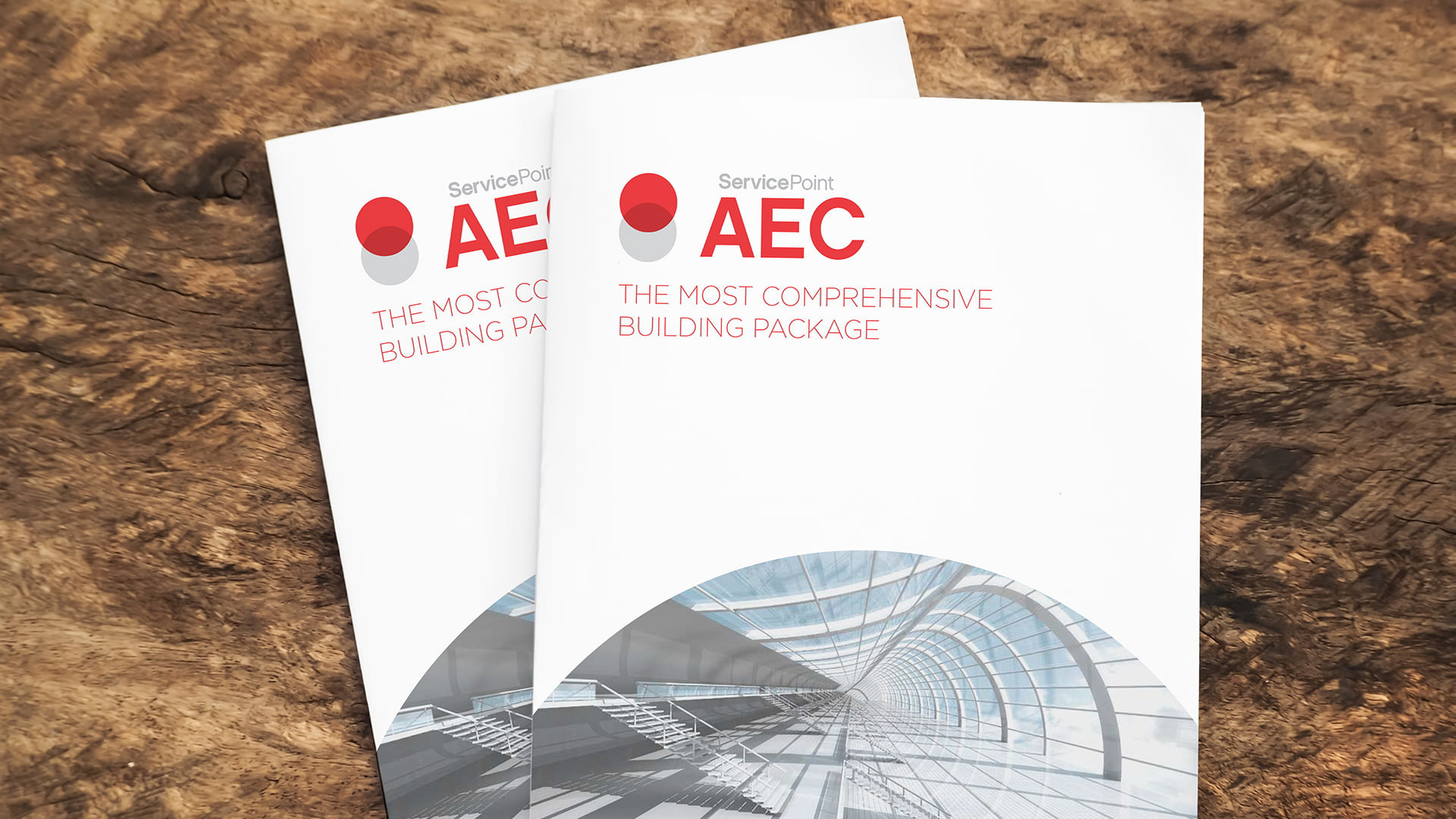 aec brochures fanned out on a wood desk