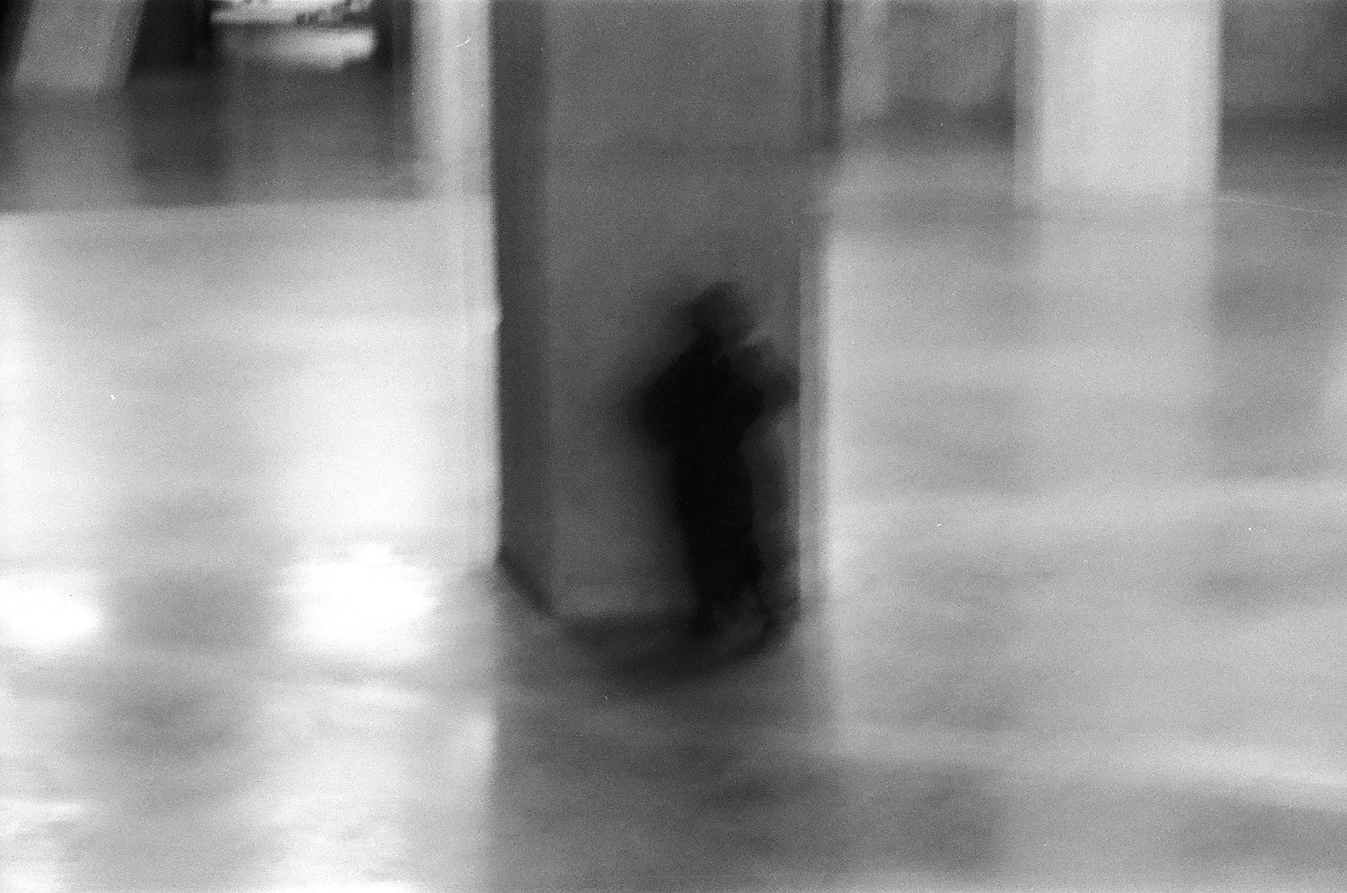 A kid hiding. London, UK. December 2023.