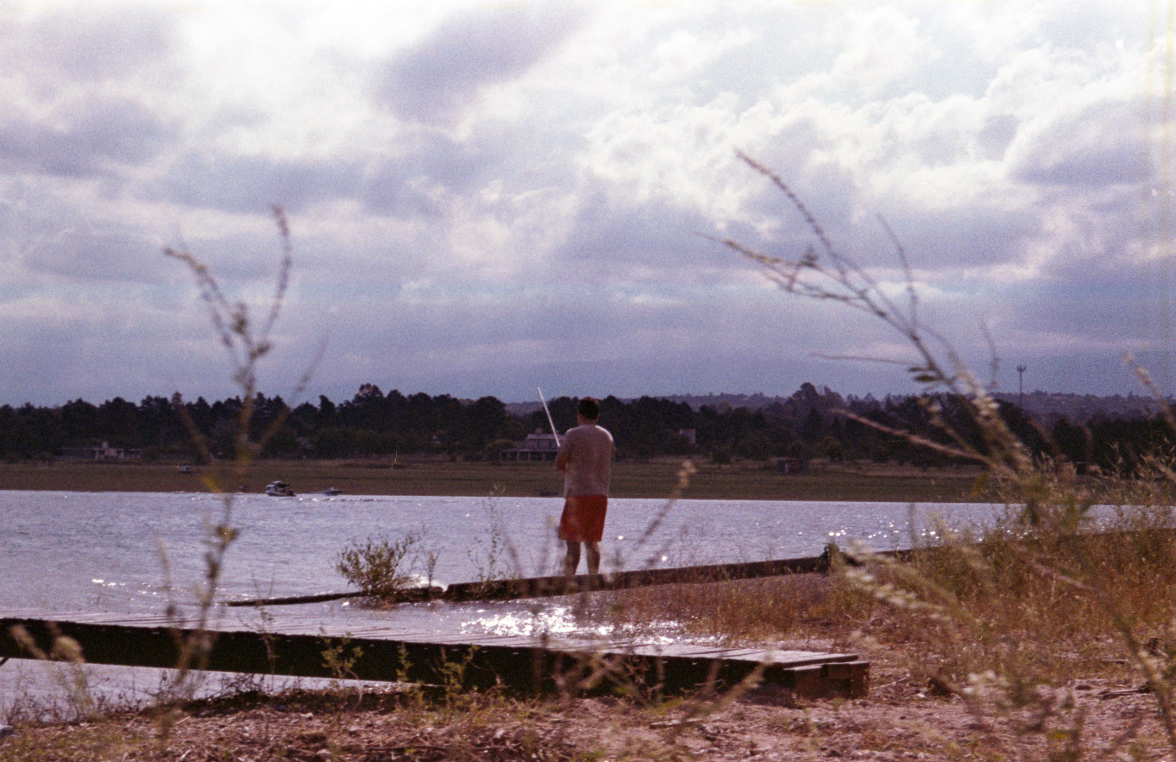A man fishing at Dique Los Molinos, Córdoba, Argentina. December 2024.