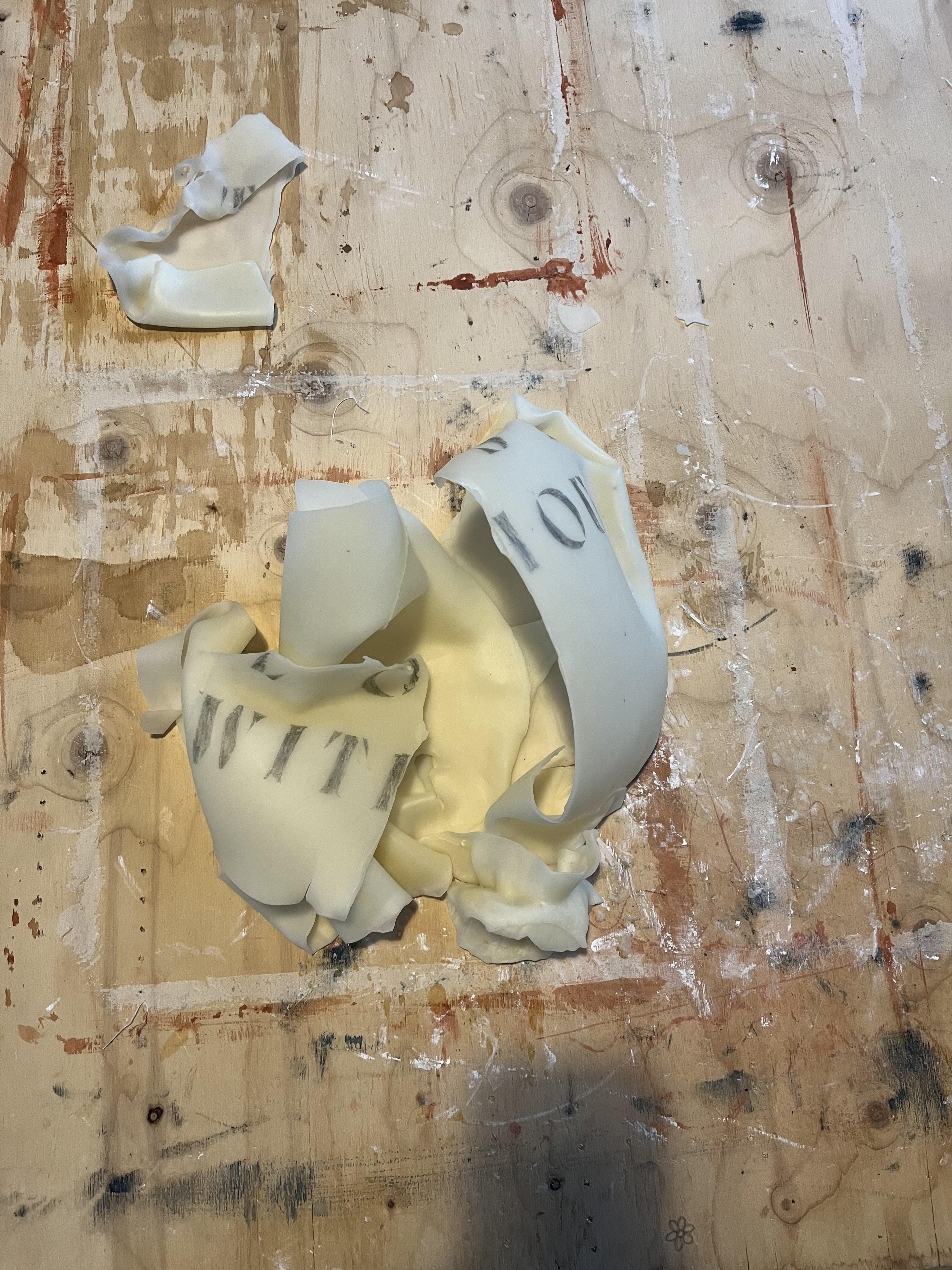 An experiment using a hairdryer to gently bend and manipulate the wax to emulate latex, an exploded balloon while still retaining some structure and material understanding of it as a wax balloon.