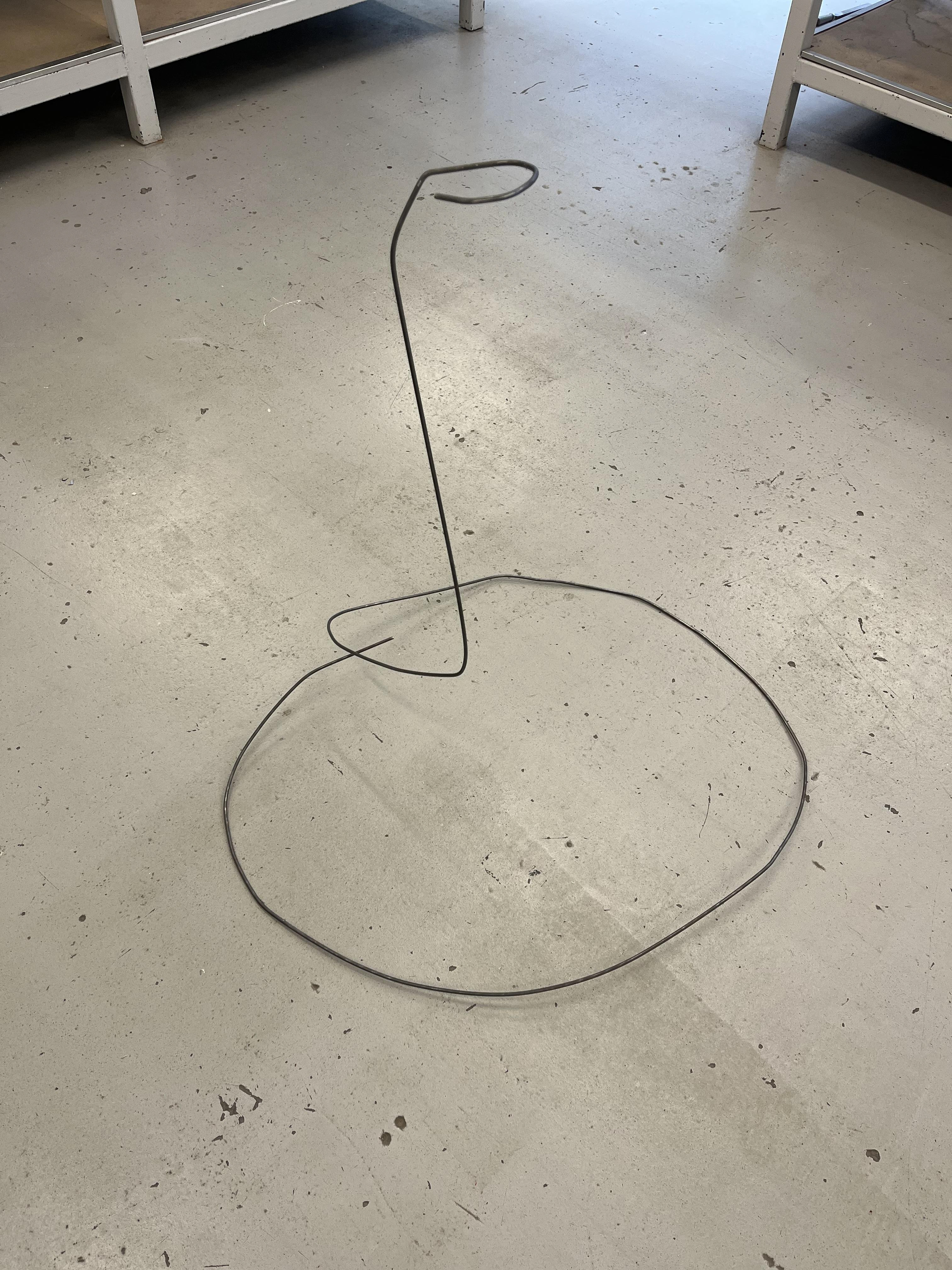 A metal workshop attempt at metal "balloon string stands"-- an interesting investigation but did not work in the end. I did't like the look of it and they were too unsturdy.