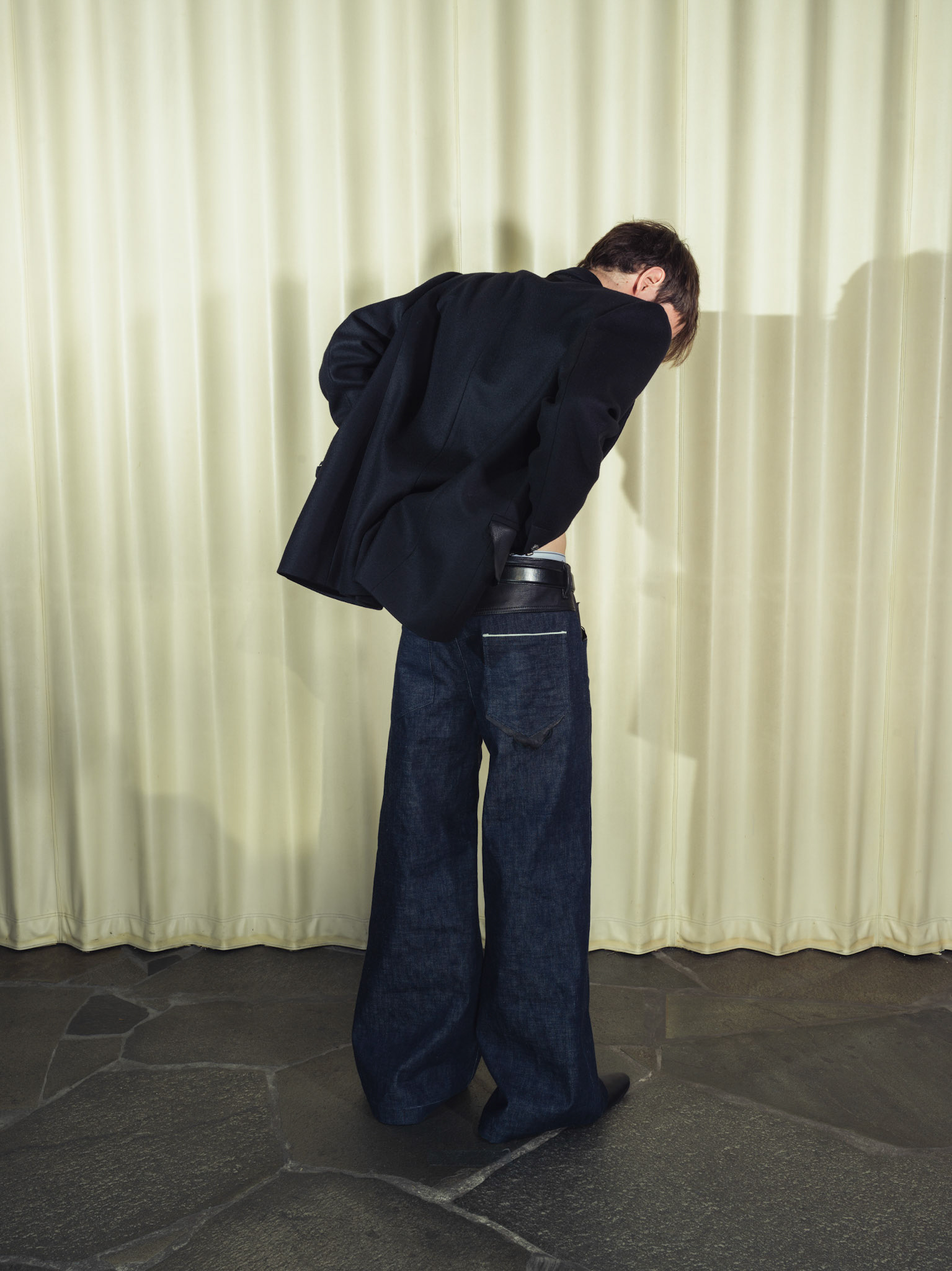 Wool cashmere double breasted blazer, Wide-leg raw selvedge denim jeans, Both with handmade silver buttons and deer leather details