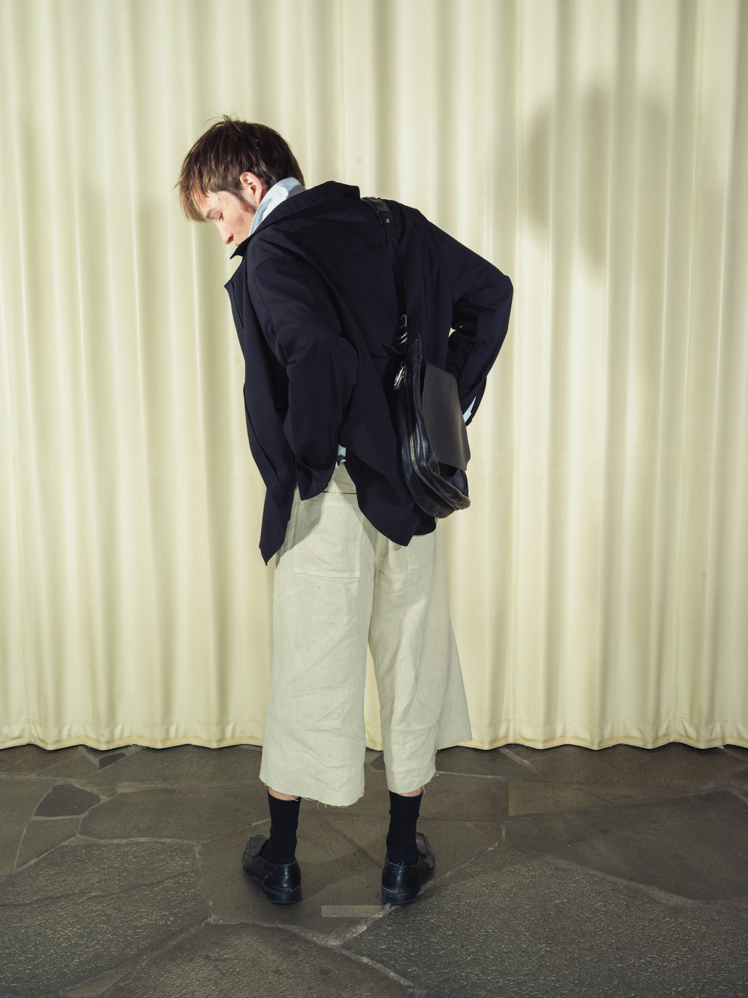 Asymmetric double-layered cotton button-up shirt and Cotton button-up shirt with fringe details, Both featuring handmade ceramic buttons, Hemp shorts with fringe details