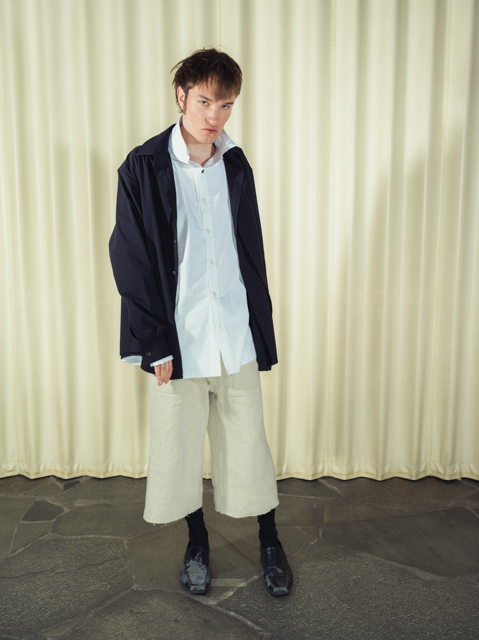 Asymmetric double-layered cotton button-up shirt and Cotton button-up shirt with fringe details, Both featuring handmade ceramic buttons, Hemp shorts with fringe details