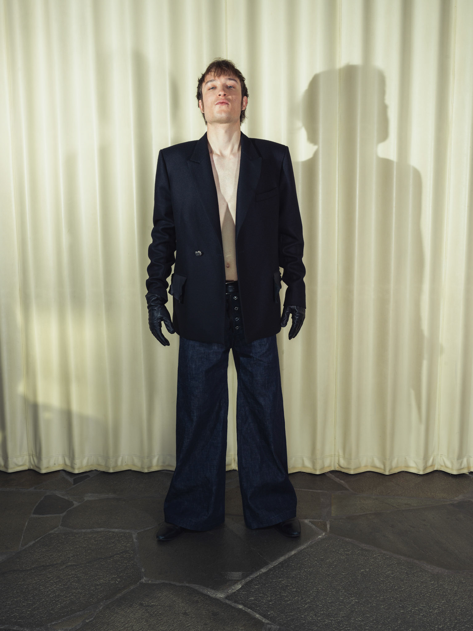 Wool cashmere double breasted blazer, Wide-leg raw selvedge denim jeans, Both with handmade silver buttons and deer leather details