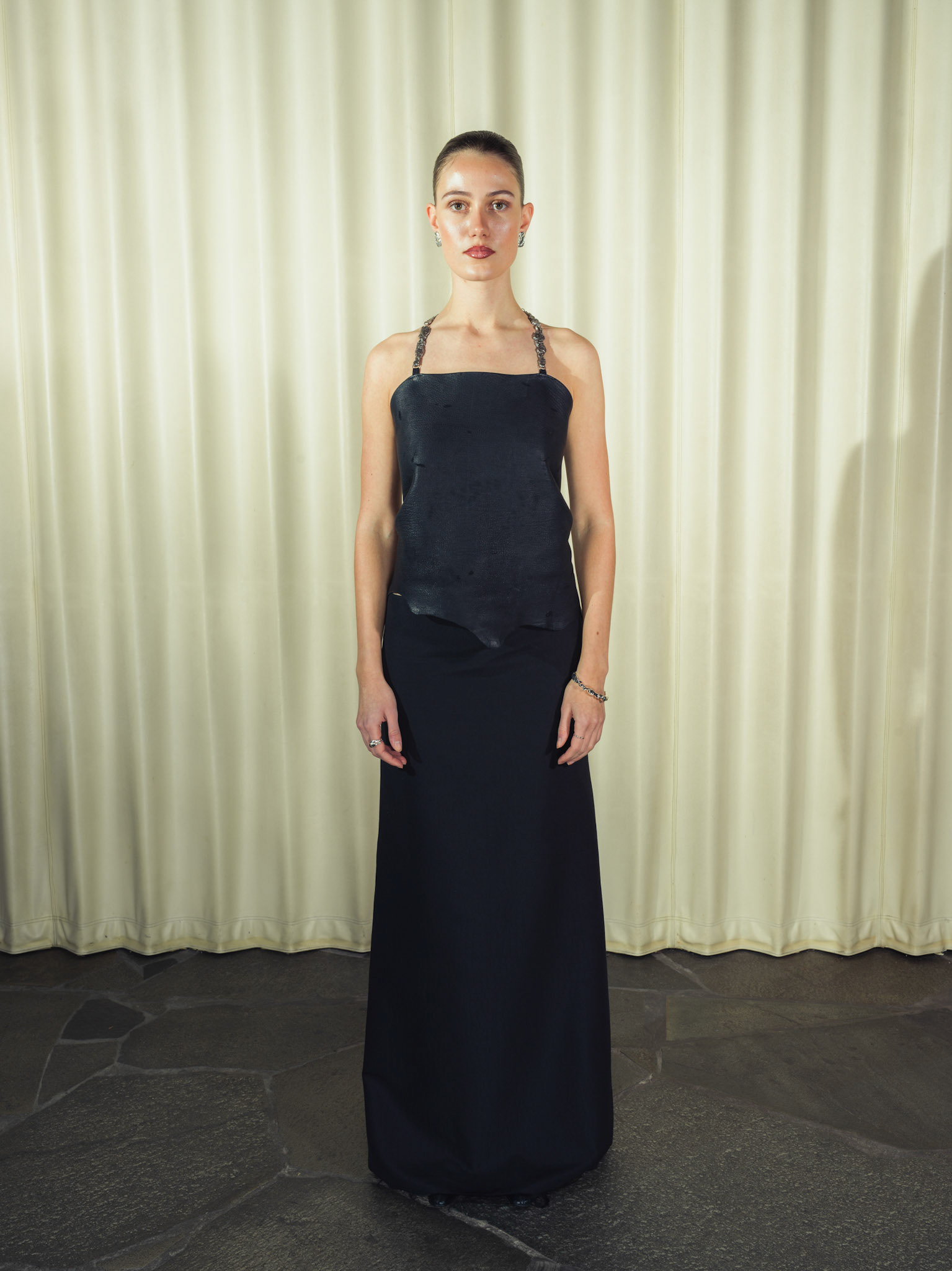 Draped raw edge deer leather top with handmade silver hardware, Jacquard silk wool maxi skirt
