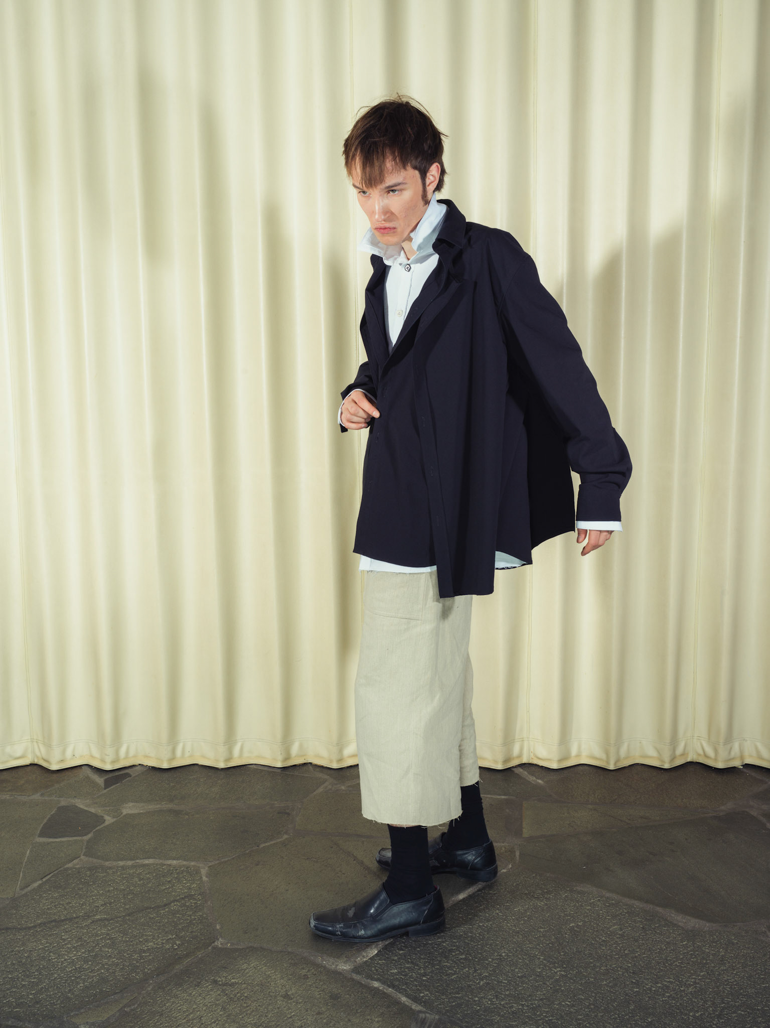 Asymmetric double-layered cotton button-up shirt and Cotton button-up shirt with fringe details, Both featuring handmade ceramic buttons, Hemp shorts with fringe details