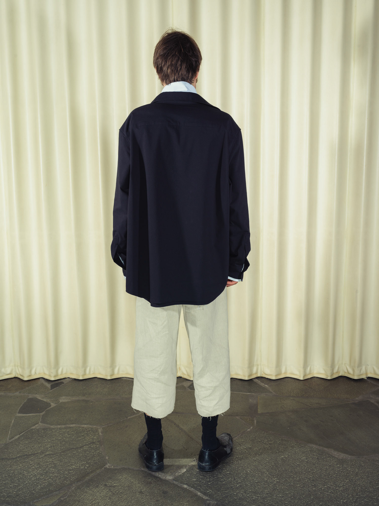 Asymmetric double-layered cotton button-up shirt and Cotton button-up shirt with fringe details, Both featuring handmade ceramic buttons, Hemp shorts with fringe details