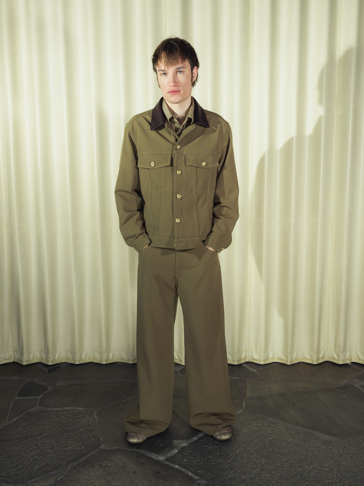 Virgin wool trucker jacket and wide-leg trousers set, Both with handmade brass buttons and deer leather details, Silk striped button-up shirt