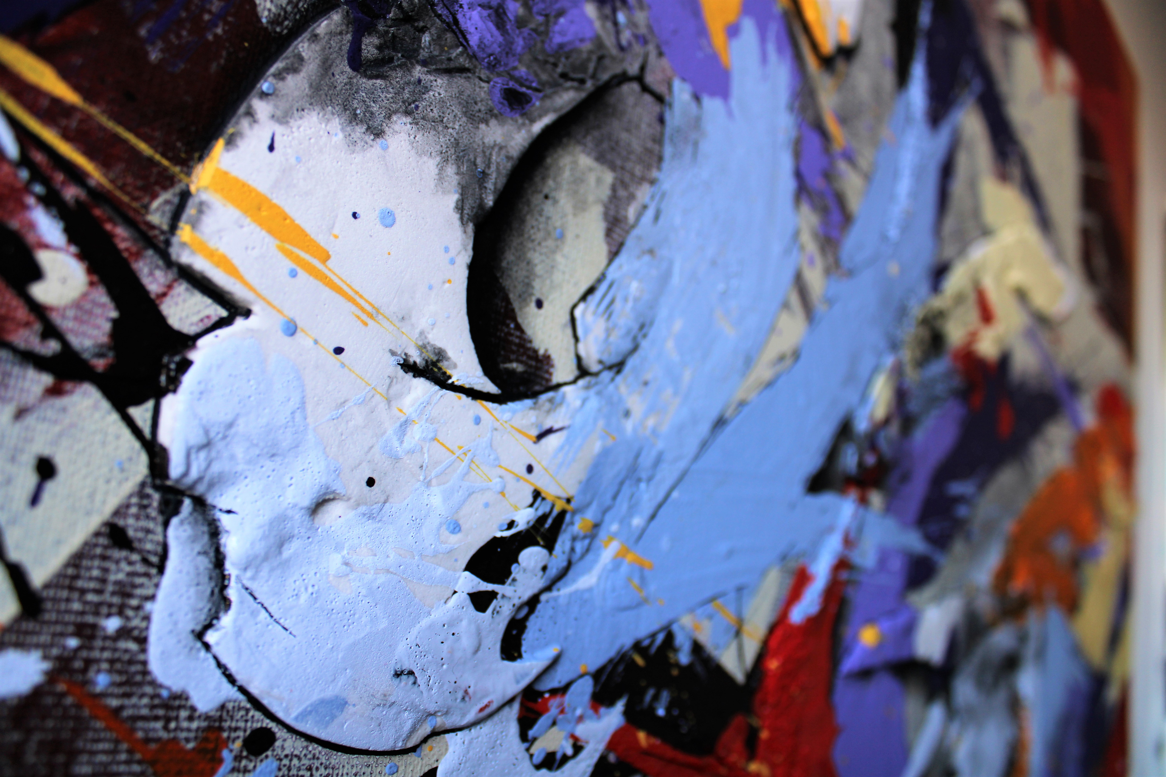 (Close-up center Detail) - In this detailed shot, the texture and depth of the work are most apparent. The coarse sand reliefs are visible within the layered history of the urban surfaces, while the bold red and black splatters against the pale cream background illustrate the energetic, informal chaos of the city street.