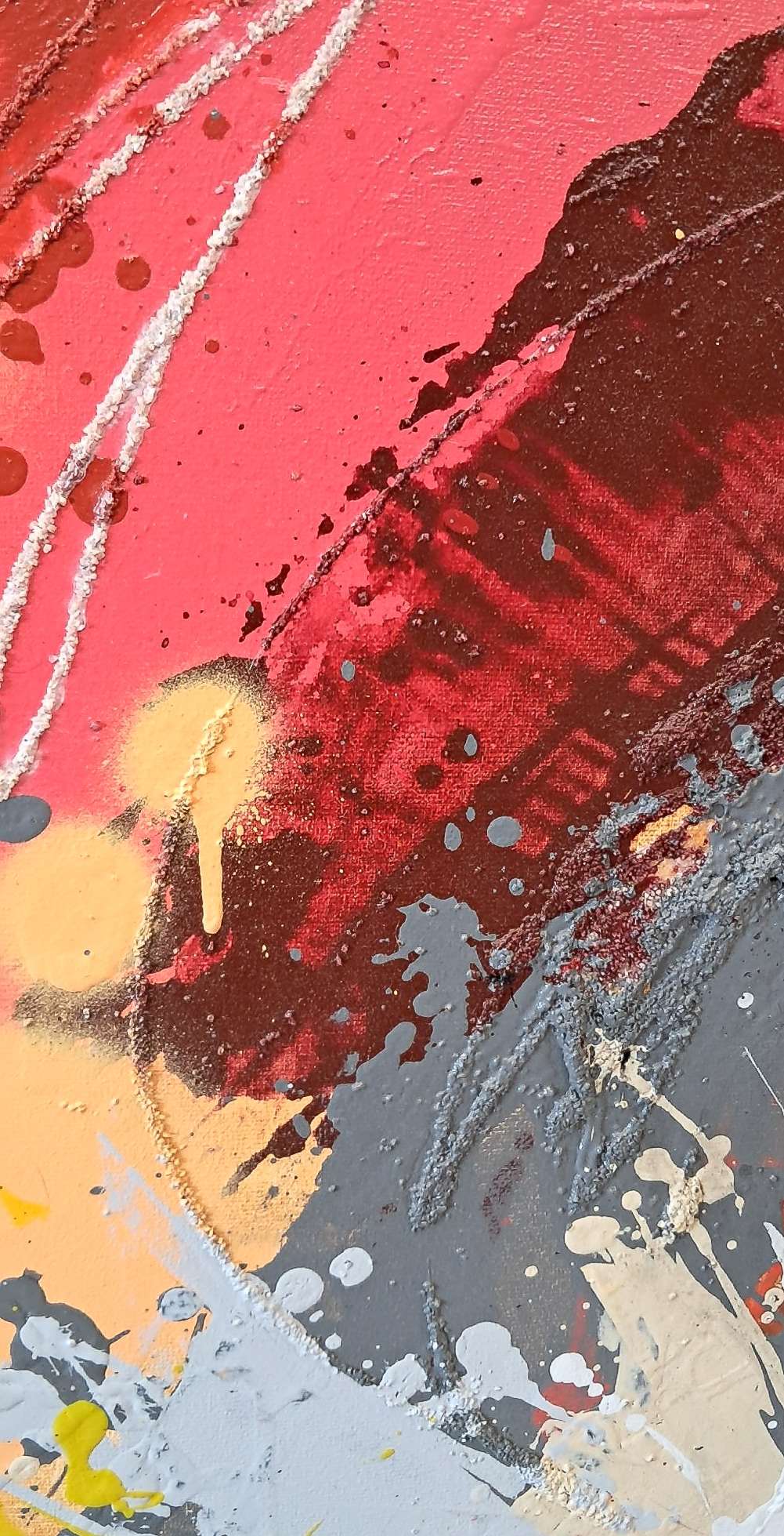 (Center Detail) - Focusing on the center of the canvas, this detailed shot captures the explosive heart of the artwork. A thick, physical relief of dark, textured paint—resembling cooling lava—dominates the area. This dark mass is dramatically encircled by a halo of brilliant, fiery red, illustrating the moment of emotional combustion and the contrast between dark and light.