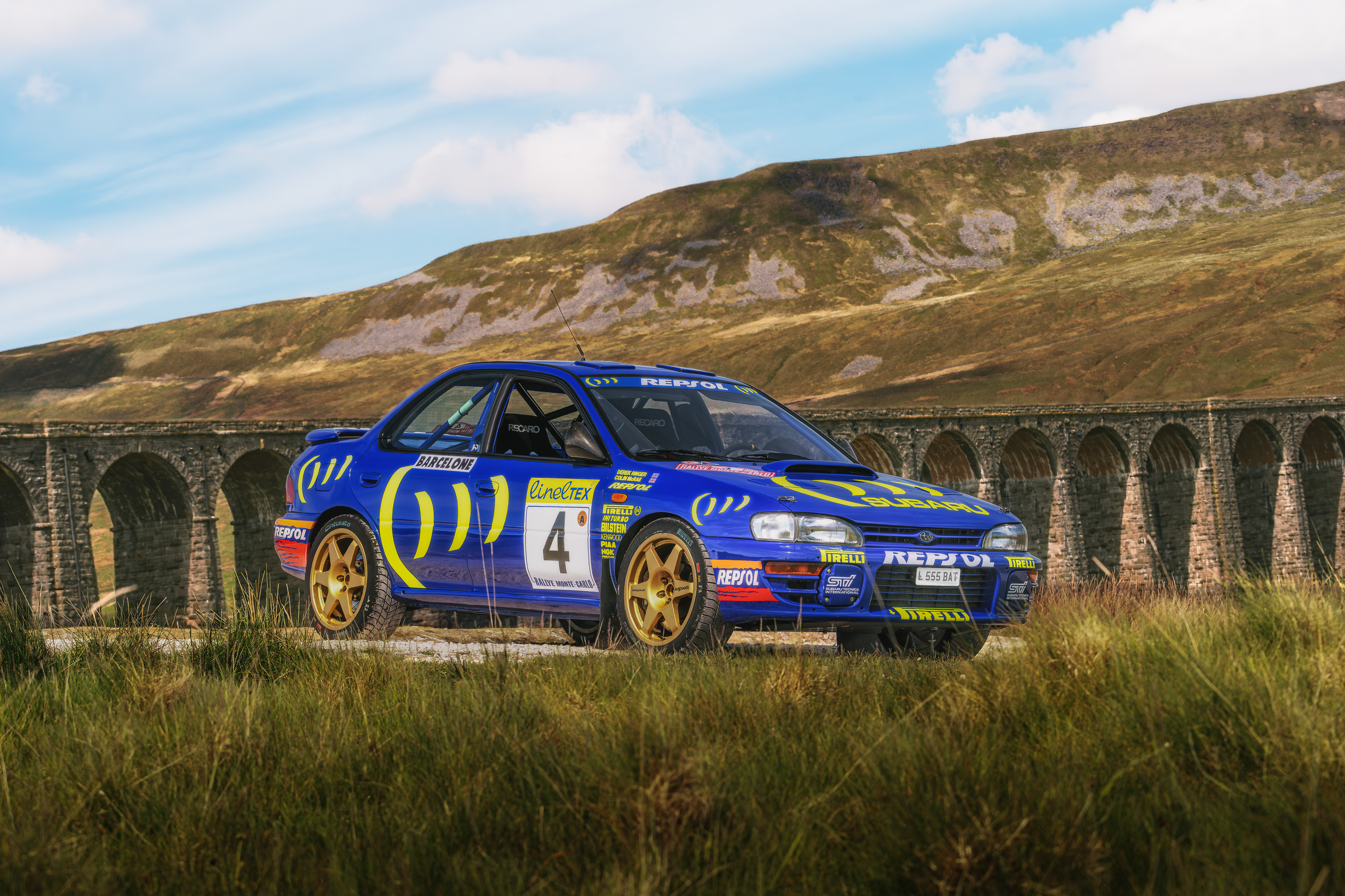 Cinematic heritage film of the Colin McRae Subaru Impreza 555, focusing on rally textures and high-speed motion.