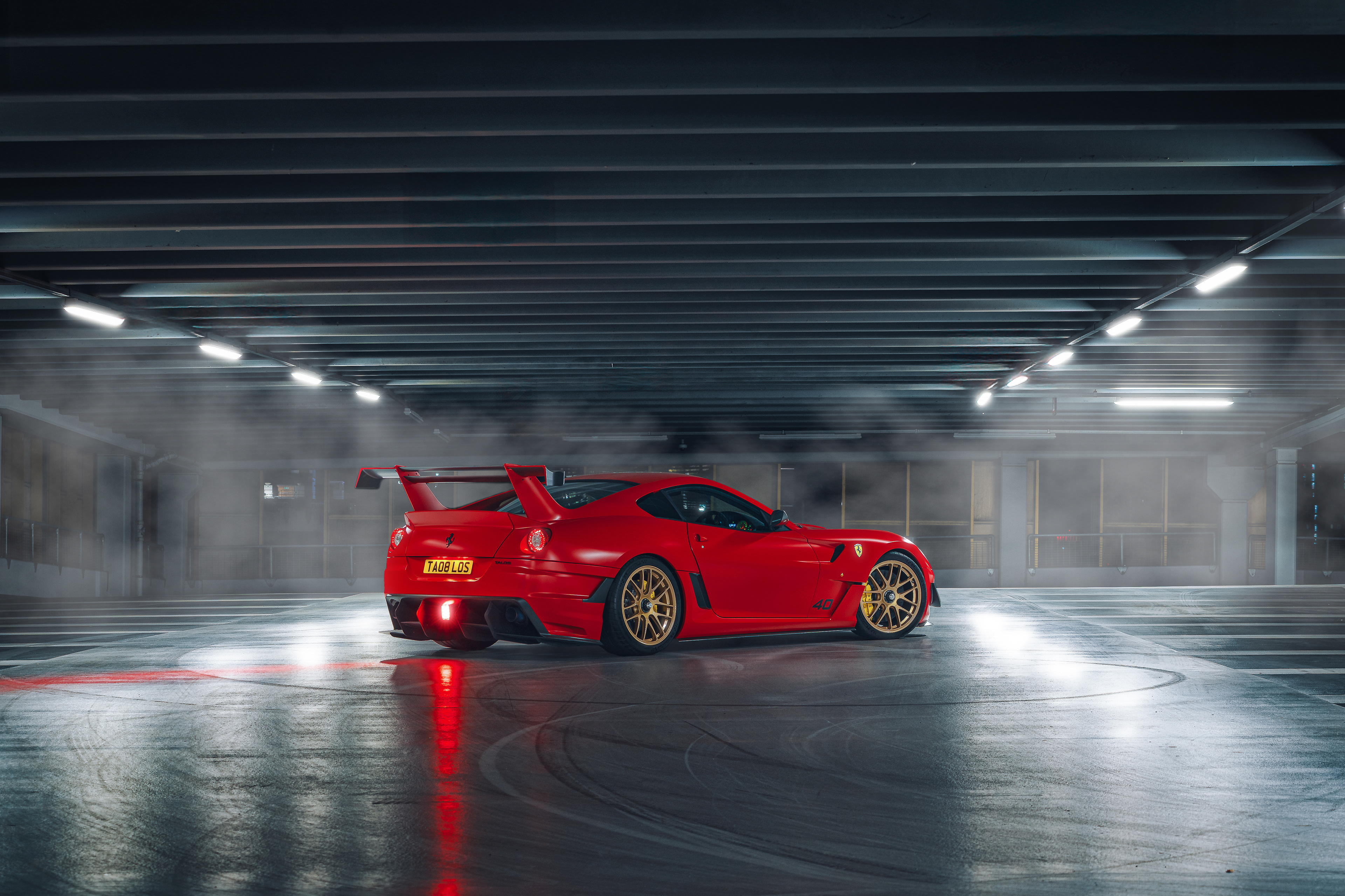 Atmospheric night cinematography of the Ferrari XXT in Manchester, highlighting urban lighting and automotive design.