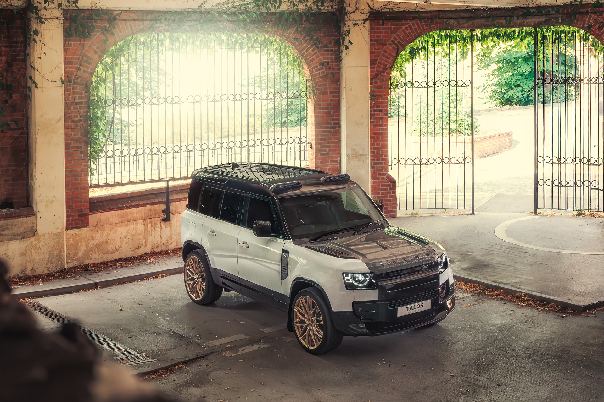 Detail-oriented cinematography of the Land Rover Defender Delta Forge Carbon, focusing on material texture and finish.
