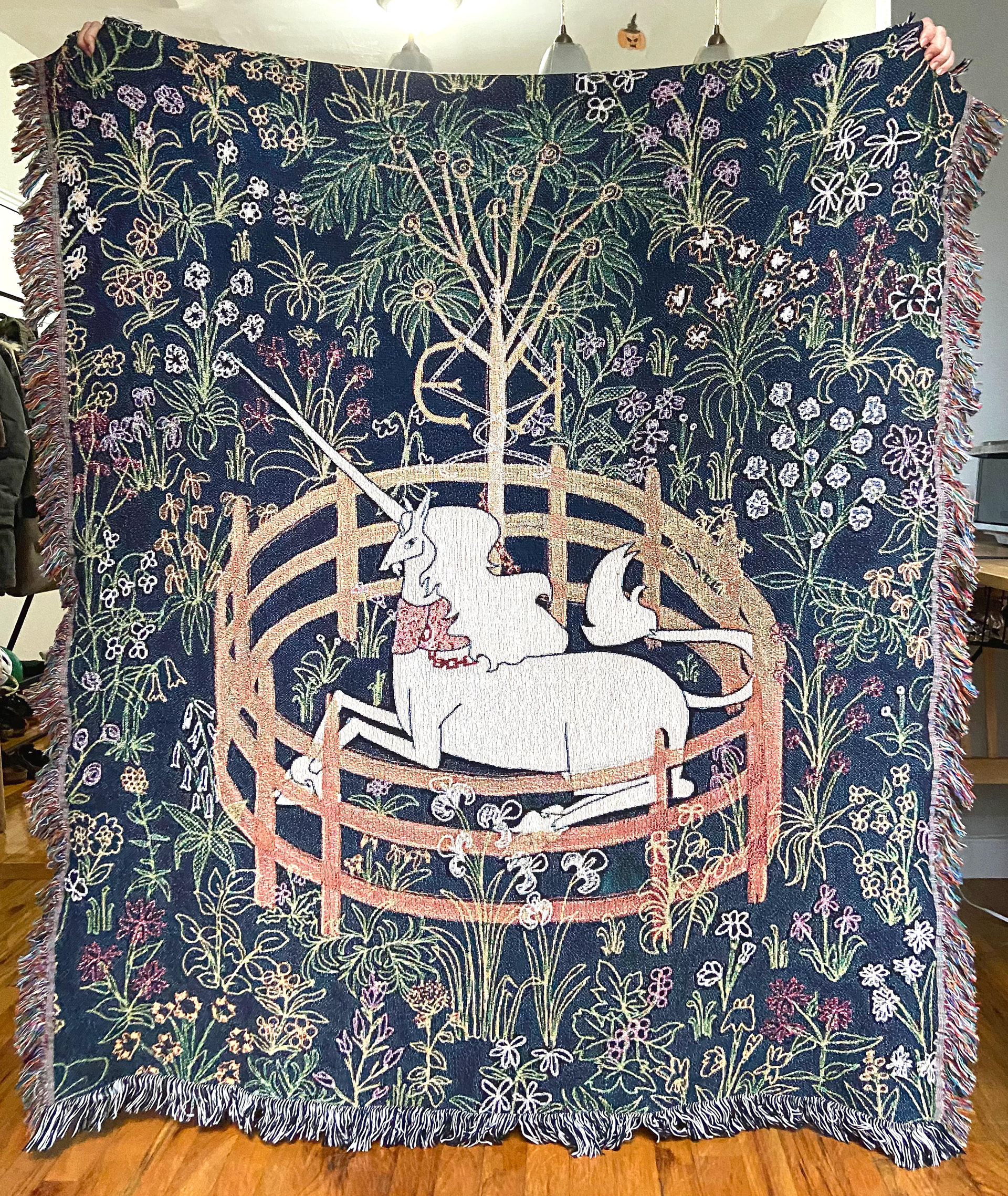 Woven wall tapestry by Edanur Kuntman depicting the Unicorn In Captivity Tapestry in her own style