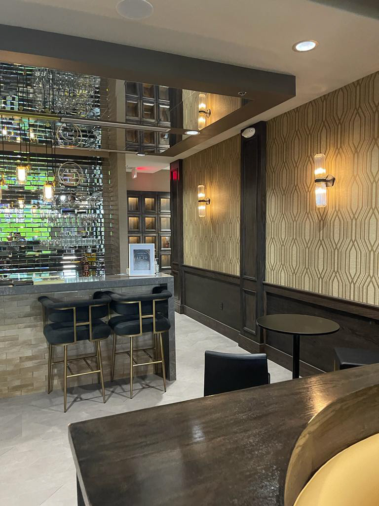 From brass sconces to woven textures, Club 1920 balances nostalgia with sophistication.