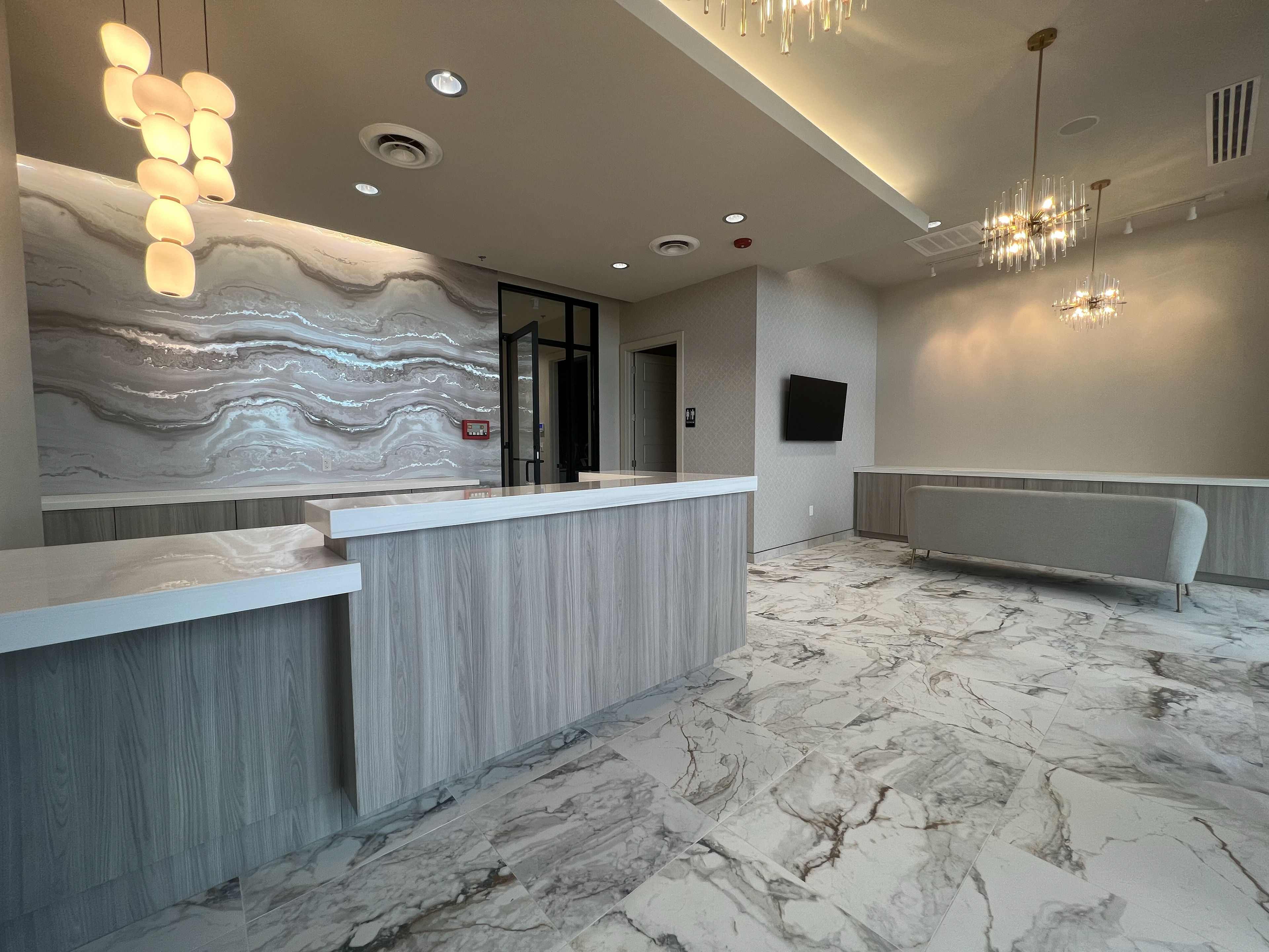 Wellness through material honesty — stone, wood, and quiet reflection.