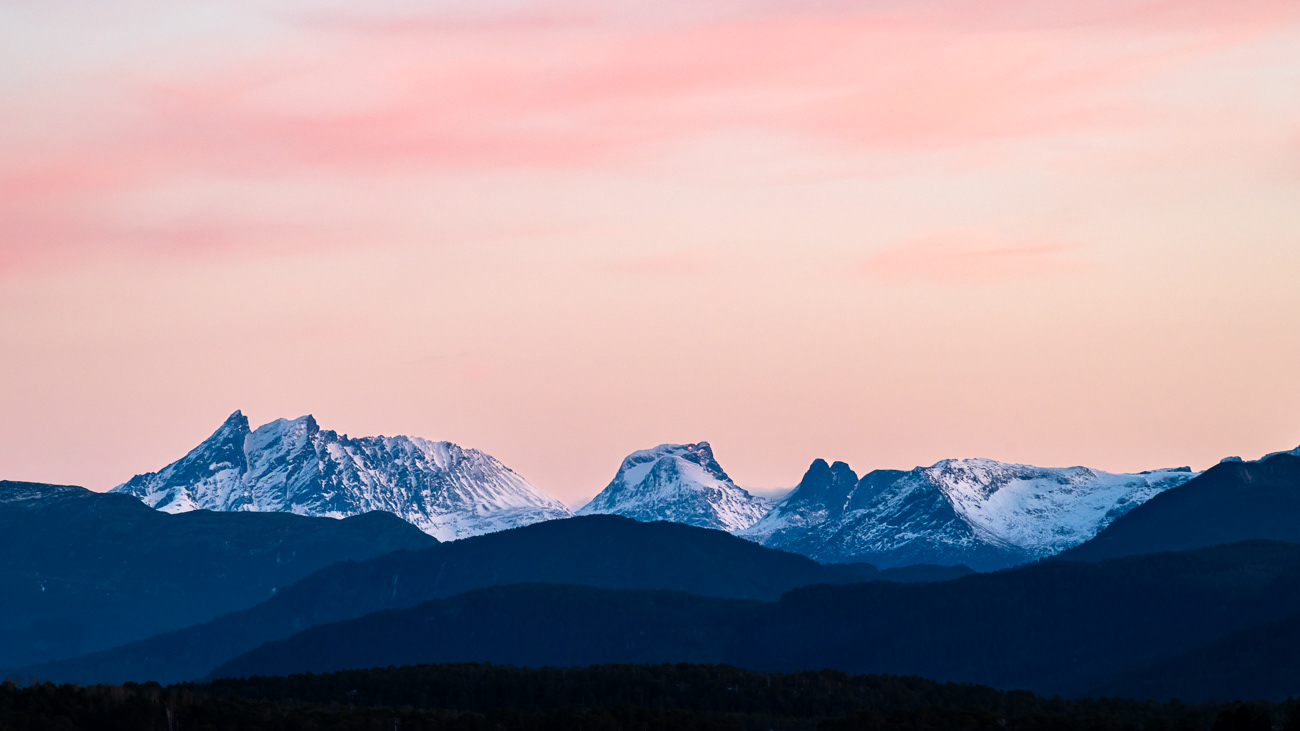Pink Hue Sunset - Molde, Norway - This image was taken from Hurtigruten MS Trollfjord in Molde, Norway looking across to snowy covered peaks - Image taken 15-11-23