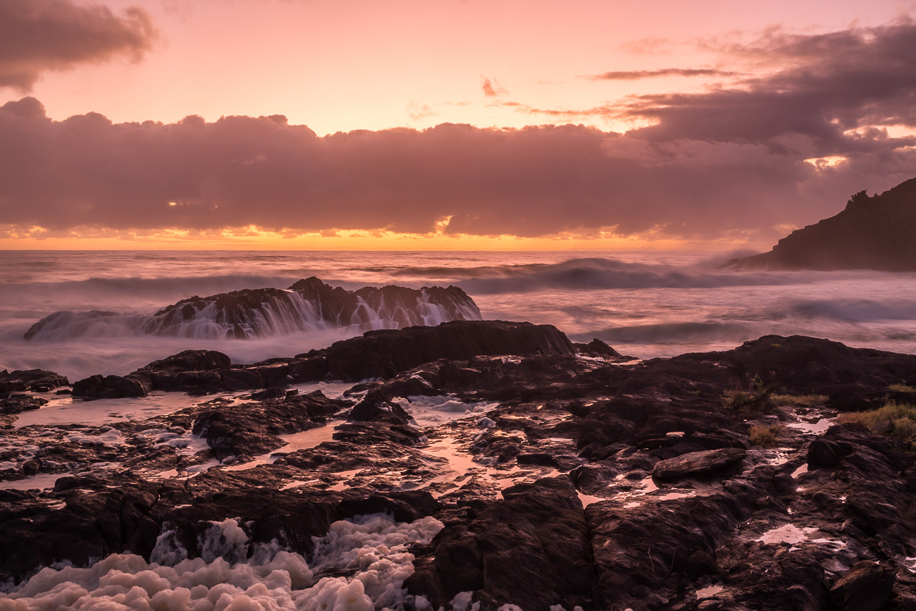 Moody Sunrise Glow - Scotts Head NSW Australia.  A very moody sunrise with large swell - Image taken 4-12-22