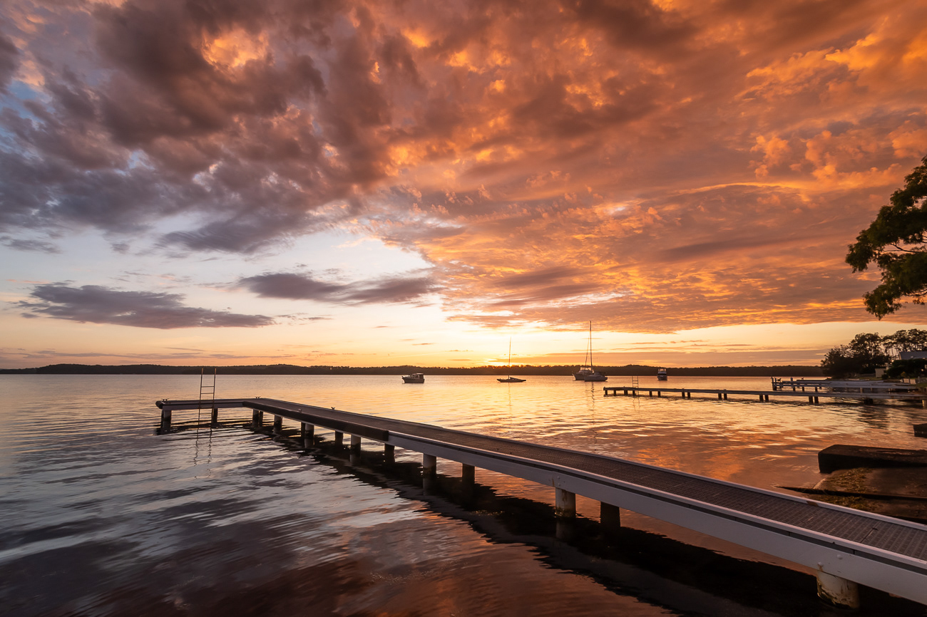 Colour Closing In - Sunshine, Lake Macquarie NSW Australia.  Colourful clouds close in on sunrise - Image taken 27-3-23