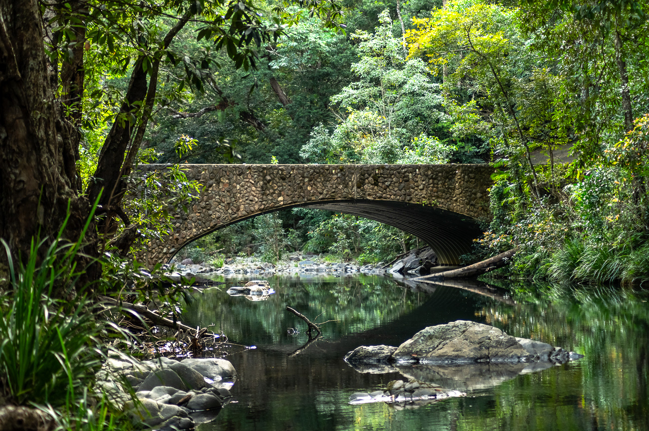 Tropical Tranquility - Wukuju Bridge, Woobadda Creek, Bloomfield Track QLD Australia.  Tranquil waters of Woobadda Creek.  A pleasant stop along the Bloomfield Track where you can swim in refreshing water - Image taken 31-7-23
