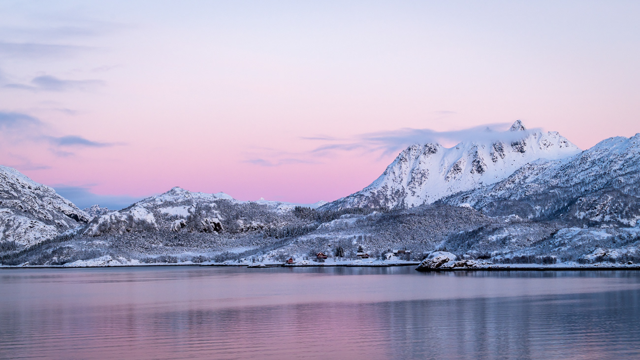 Magical Mountains - Norway.  Image taken from Hurtigruten MS Trollfjord looking across to a small town and snow covered peaks - Image taken 20-11-23
