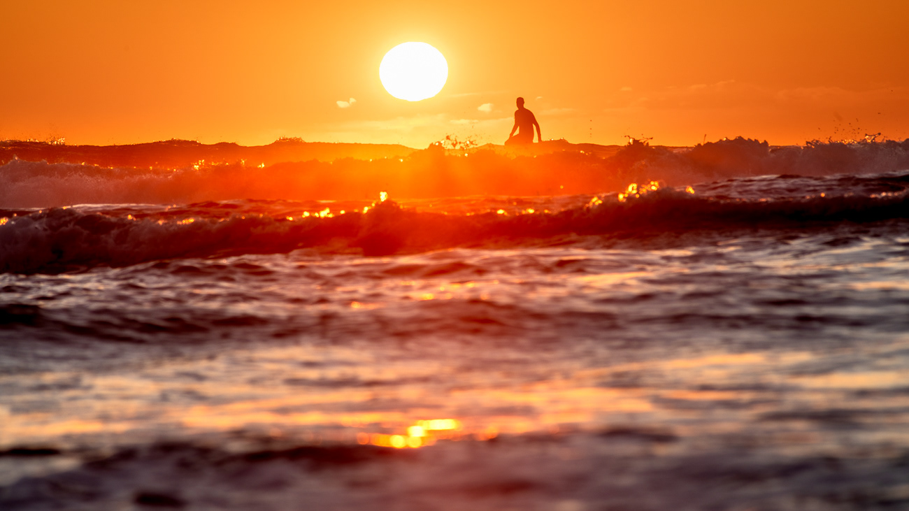 Sunrise Surf - Bonny Hills NSW Australia.  Golden glow for this surfer - Image taken 28-8-24
