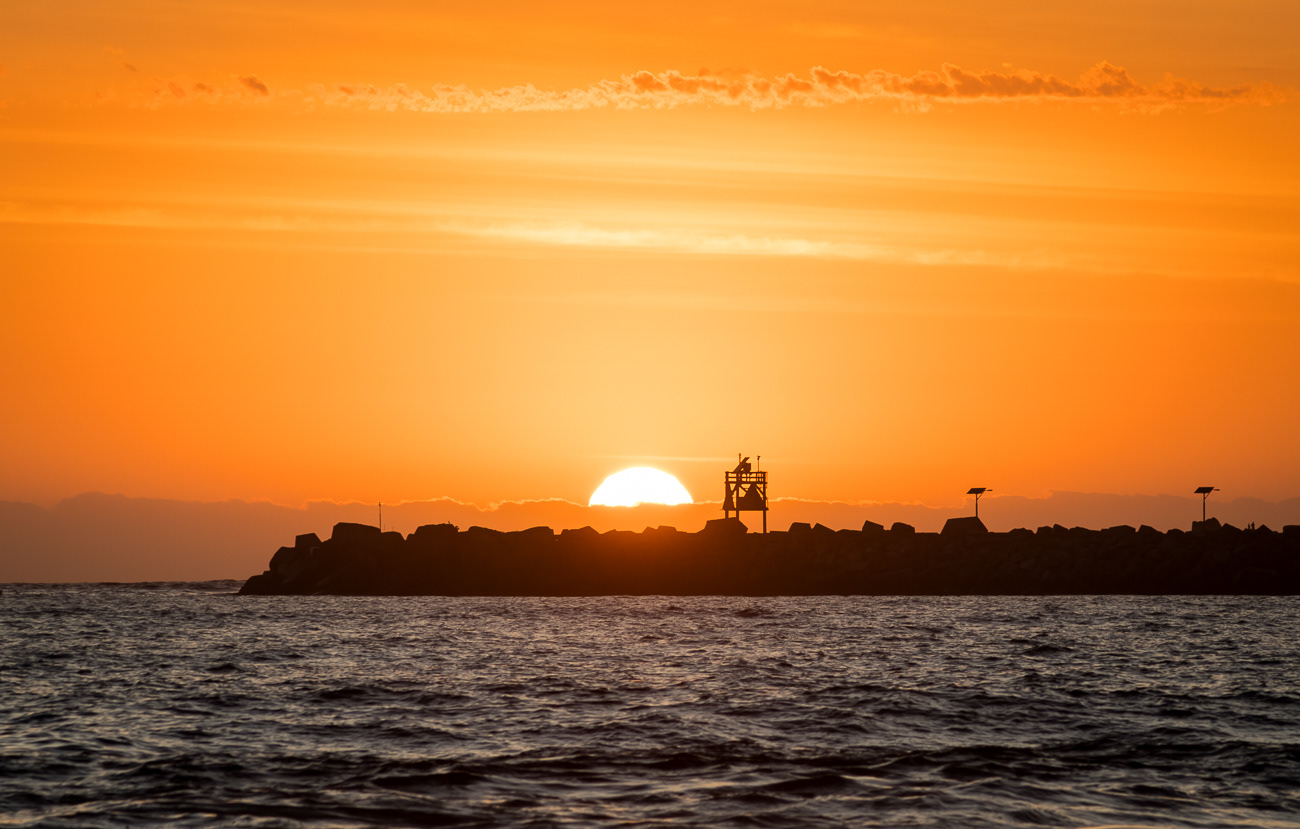 Rising Sun - Stockton Beach NSW Australia.  Sun rising beyond Stockton Breakwall - Image taken 29-1-23