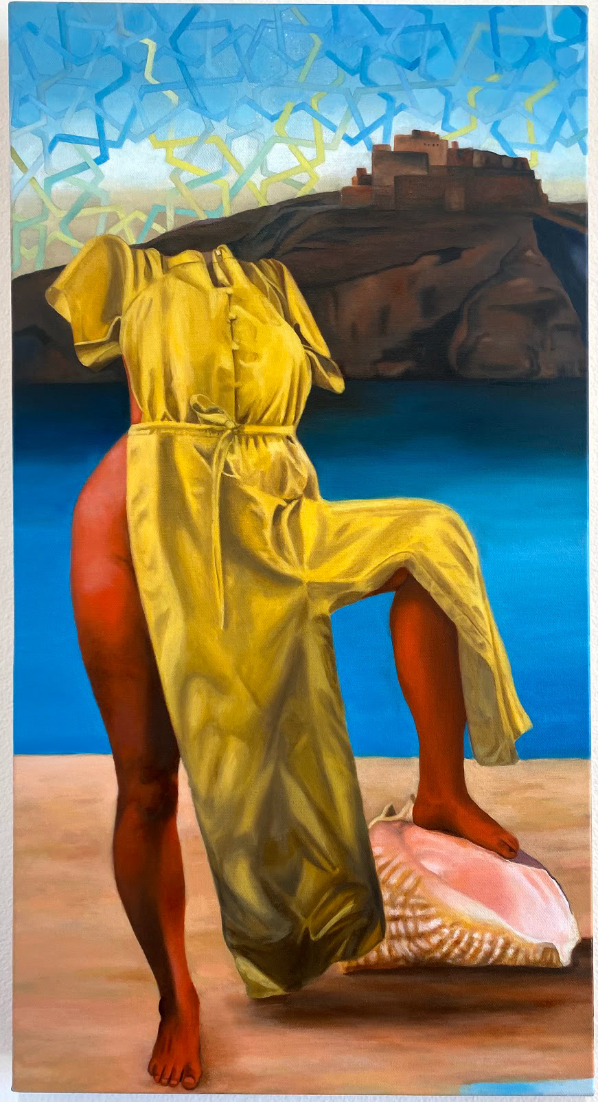 Painting of yellow dress on a human form with no head and a blue sky and sea with building in the background